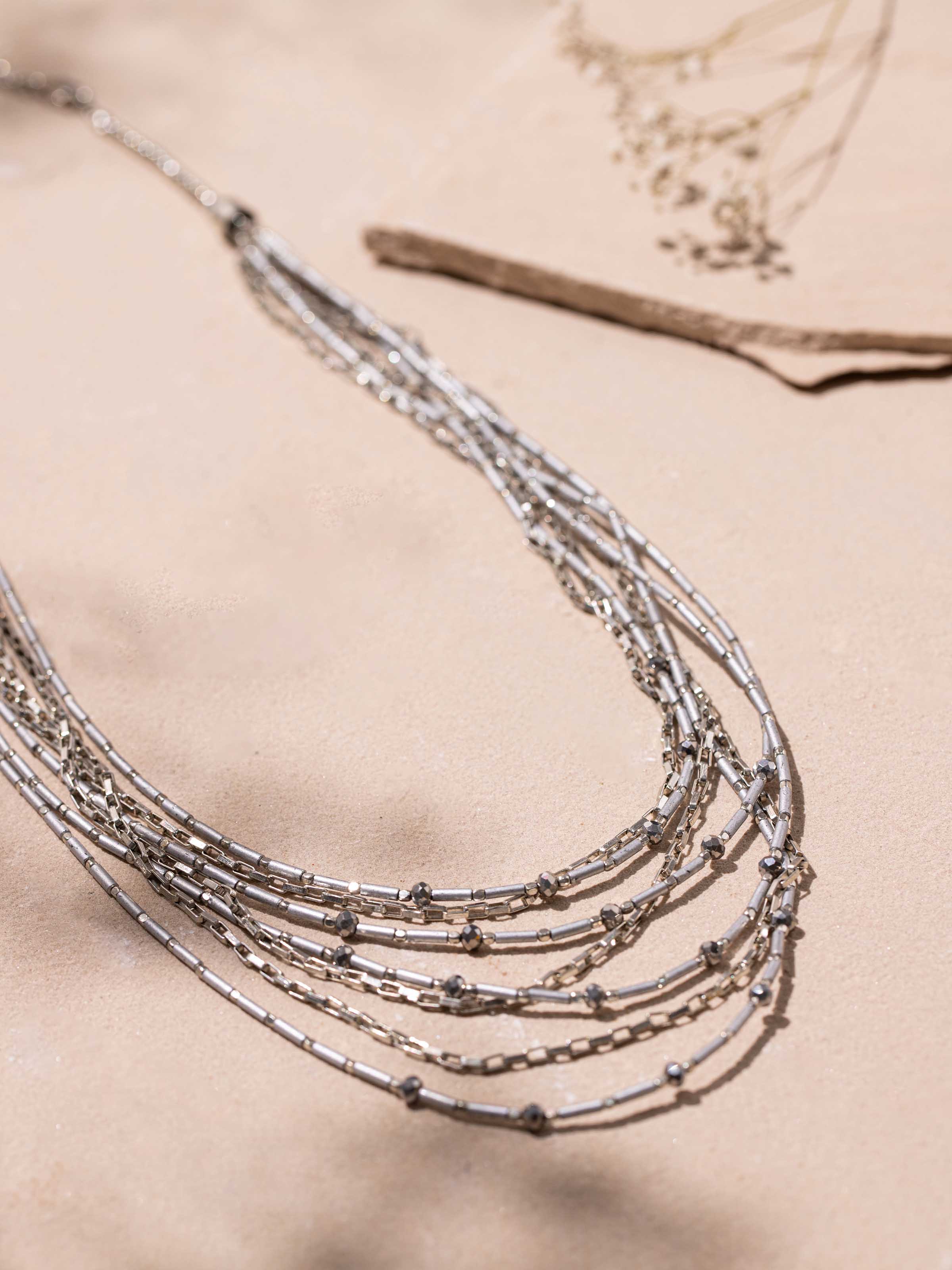 Detailed close-up of handcrafted collar necklace showcasing its ornate design and detailed craftsmanship