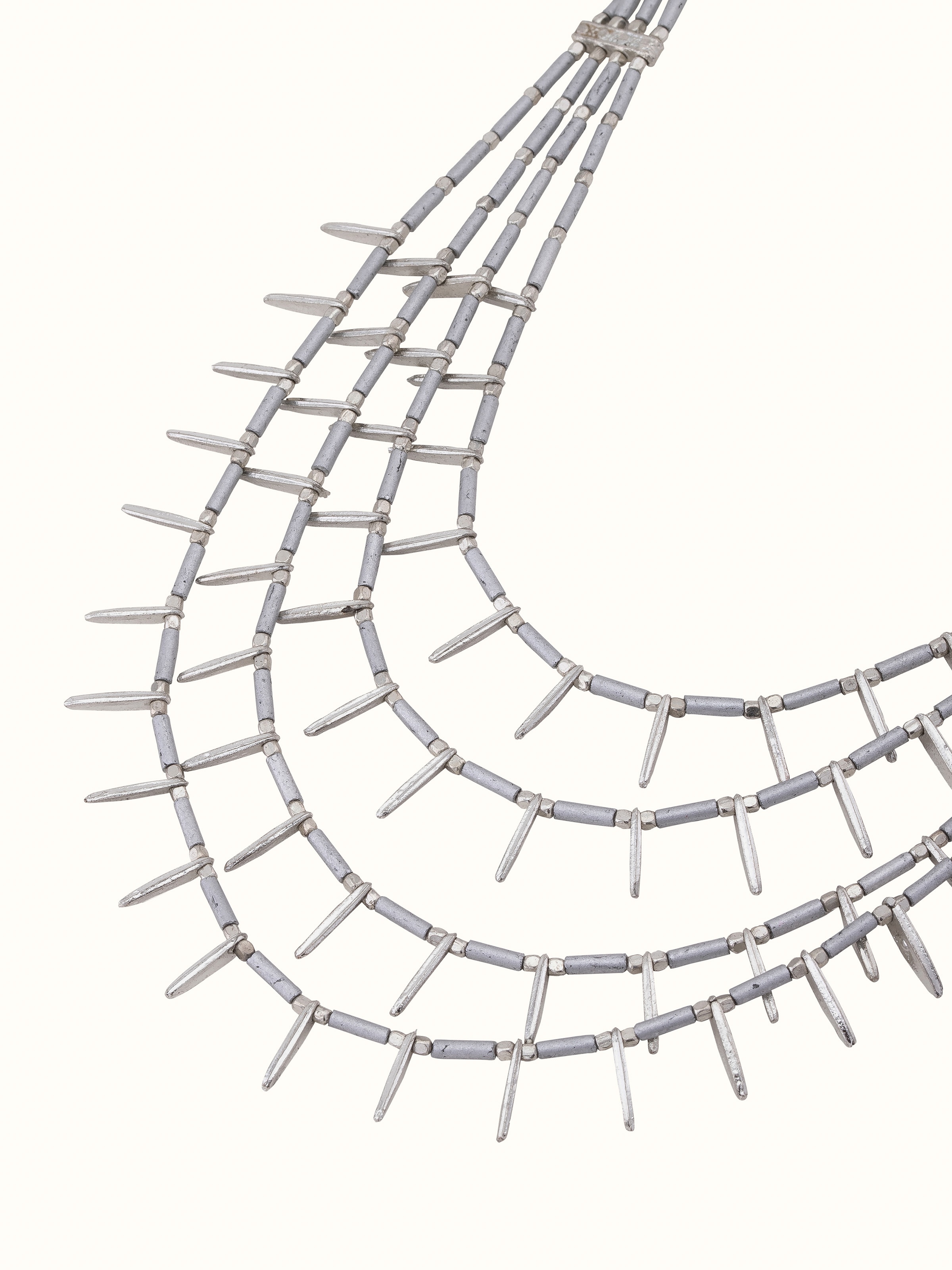 Overhead view of handcrafted collar necklace displaying its full design and structure.