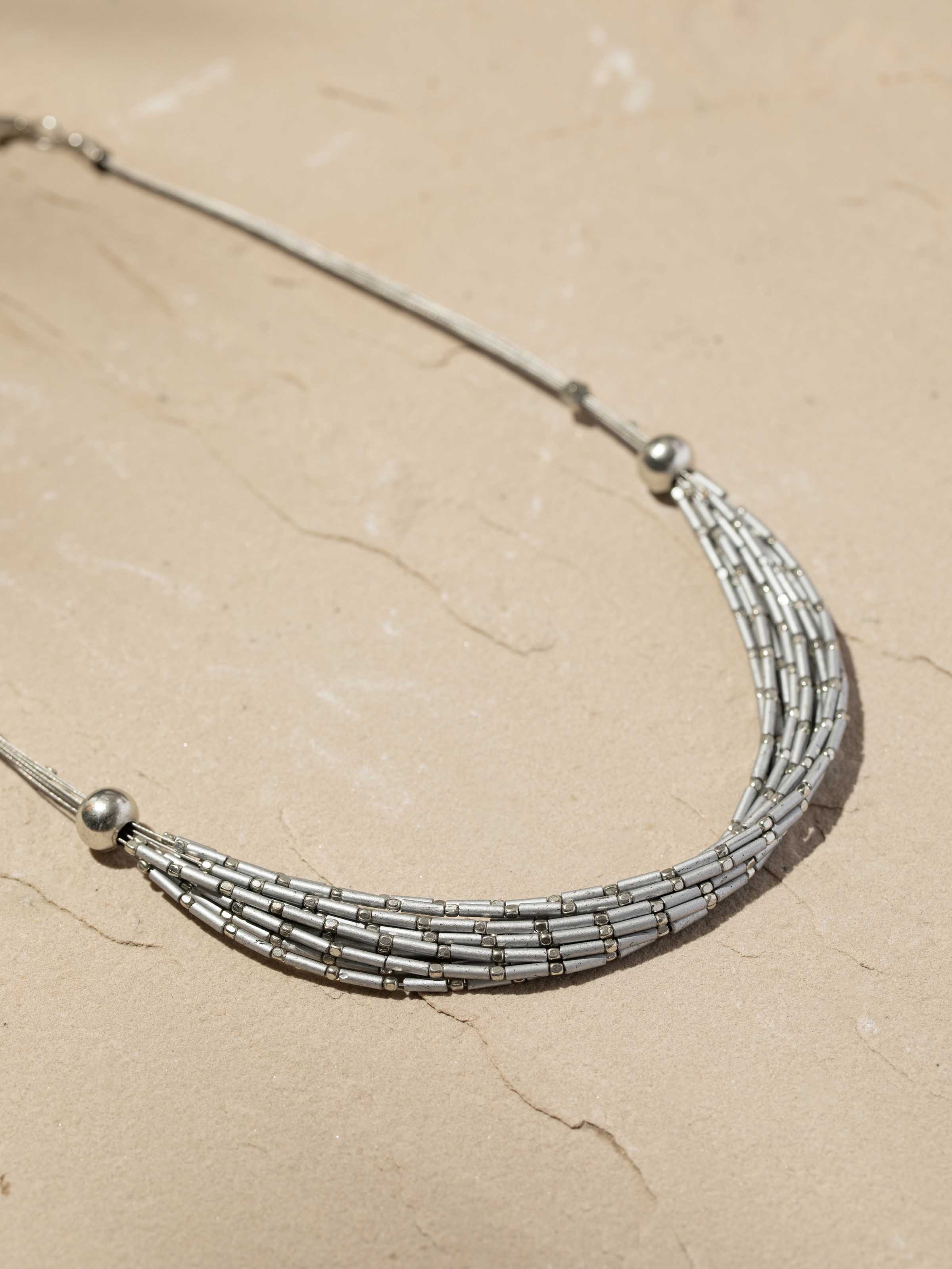 Back view of Handcrafted Collar Necklace highlighting clasp and design details.