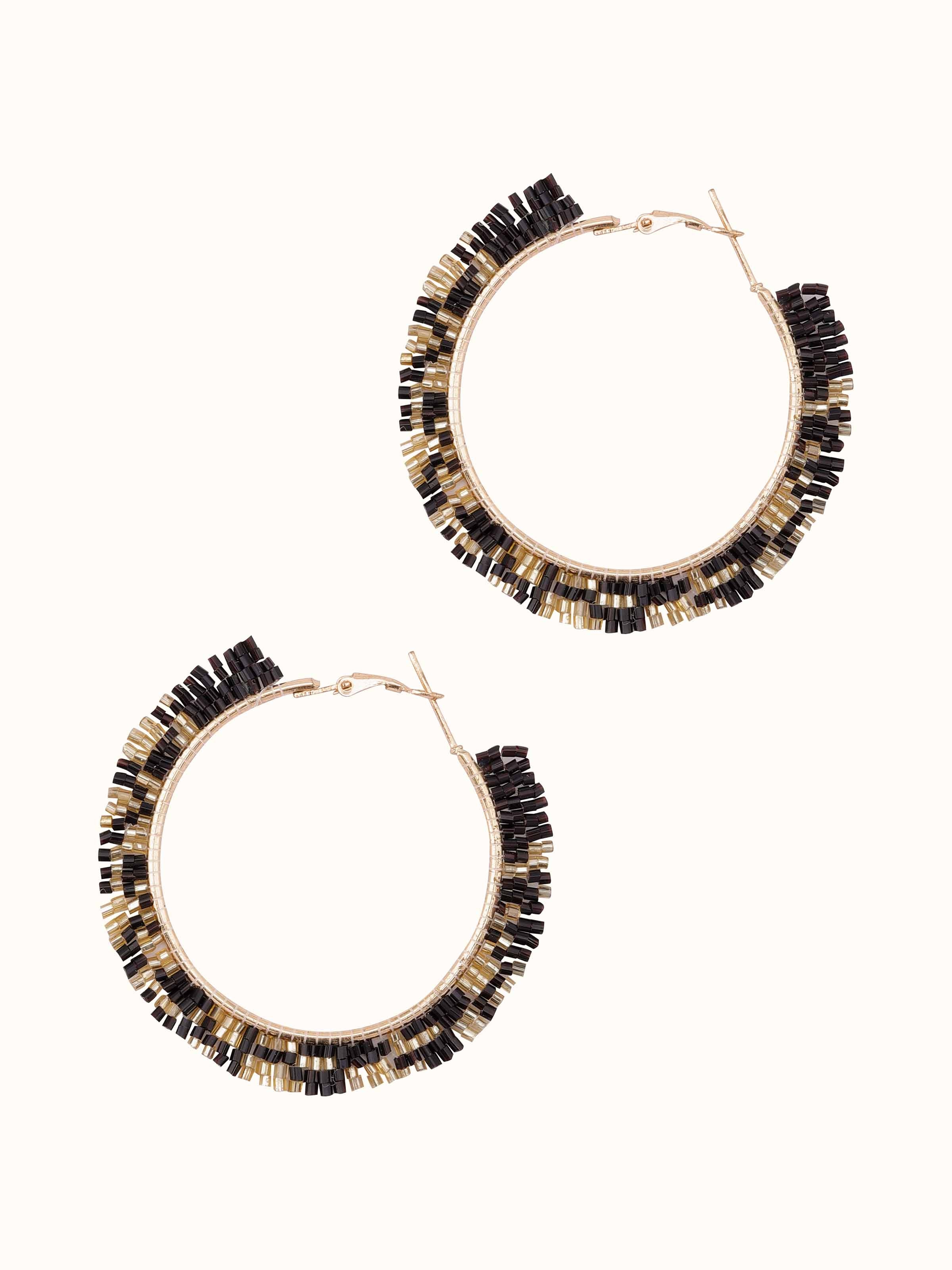 Angled view of Handcrafted Hoop Earrings showcasing elegant hoop design and detailed craftsmanship.