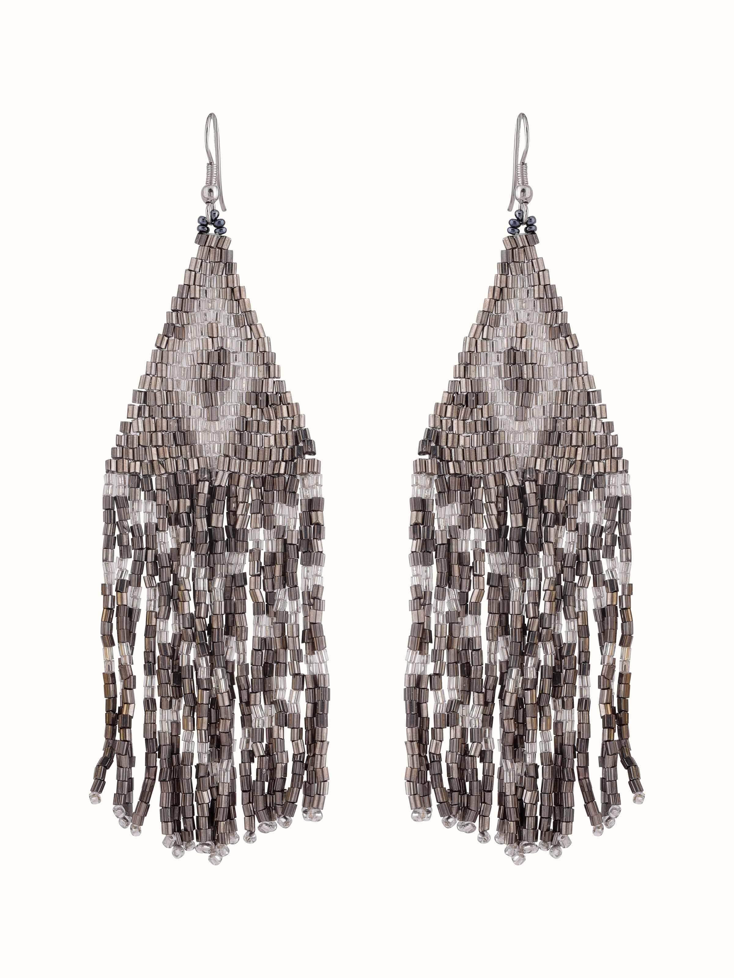 Front view of handcrafted drop earrings with artistic design and intricate metalwork.