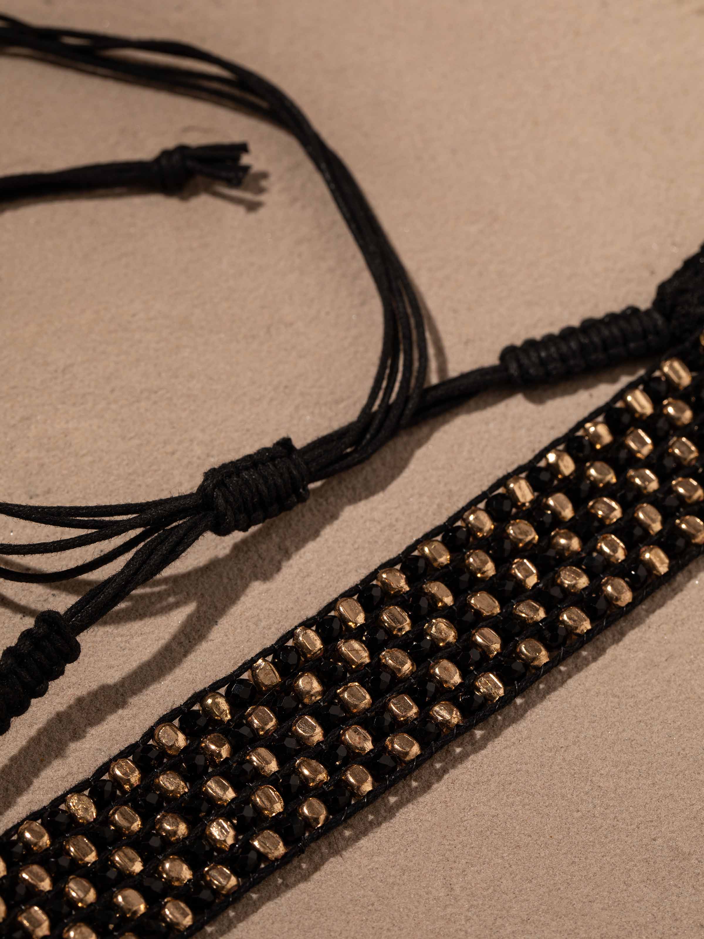Back view of handcrafted choker highlighting the clasp and closure mechanism.