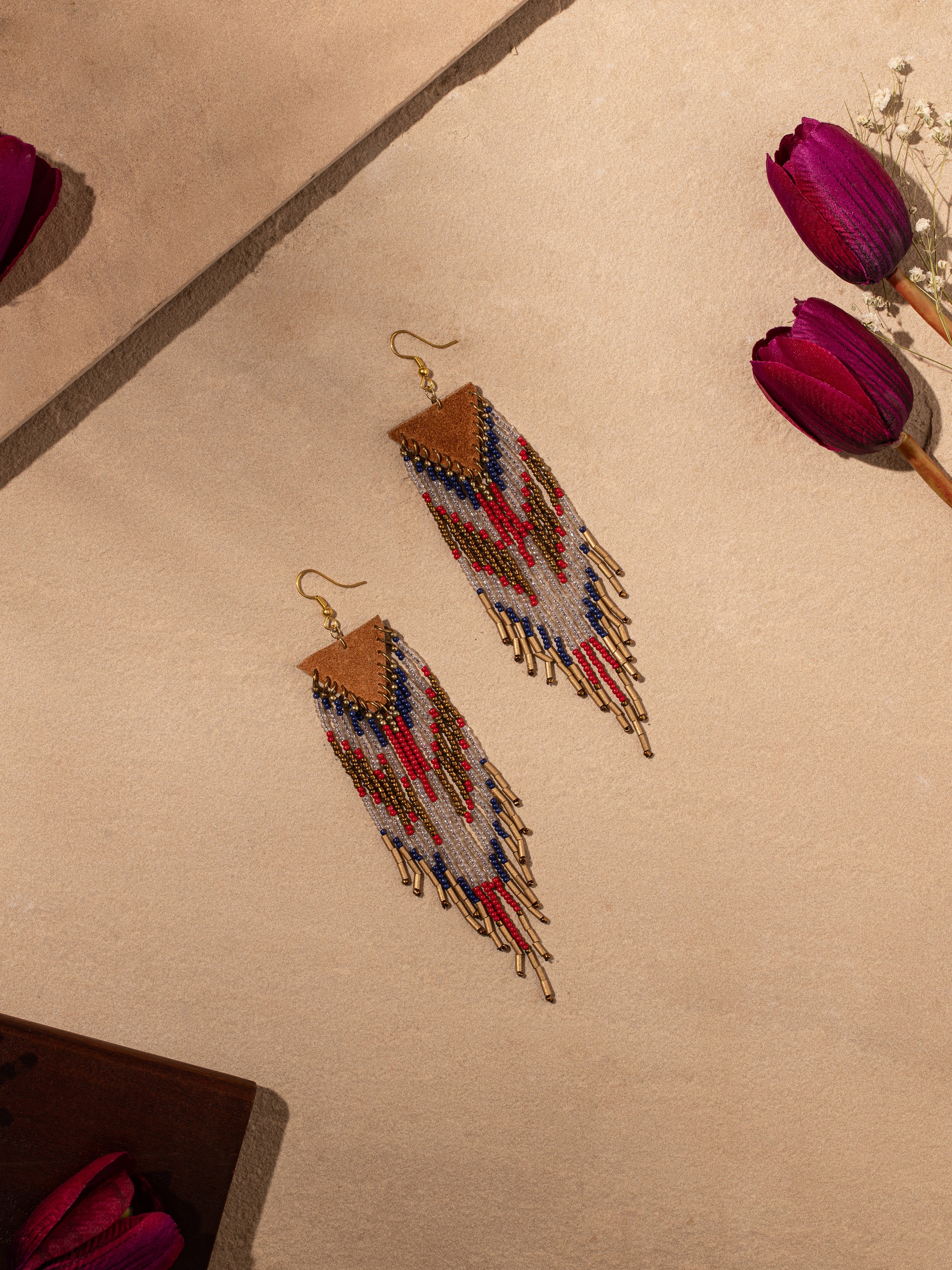 Close-up view of handcrafted drop earrings showcasing the intricate design and fine details.