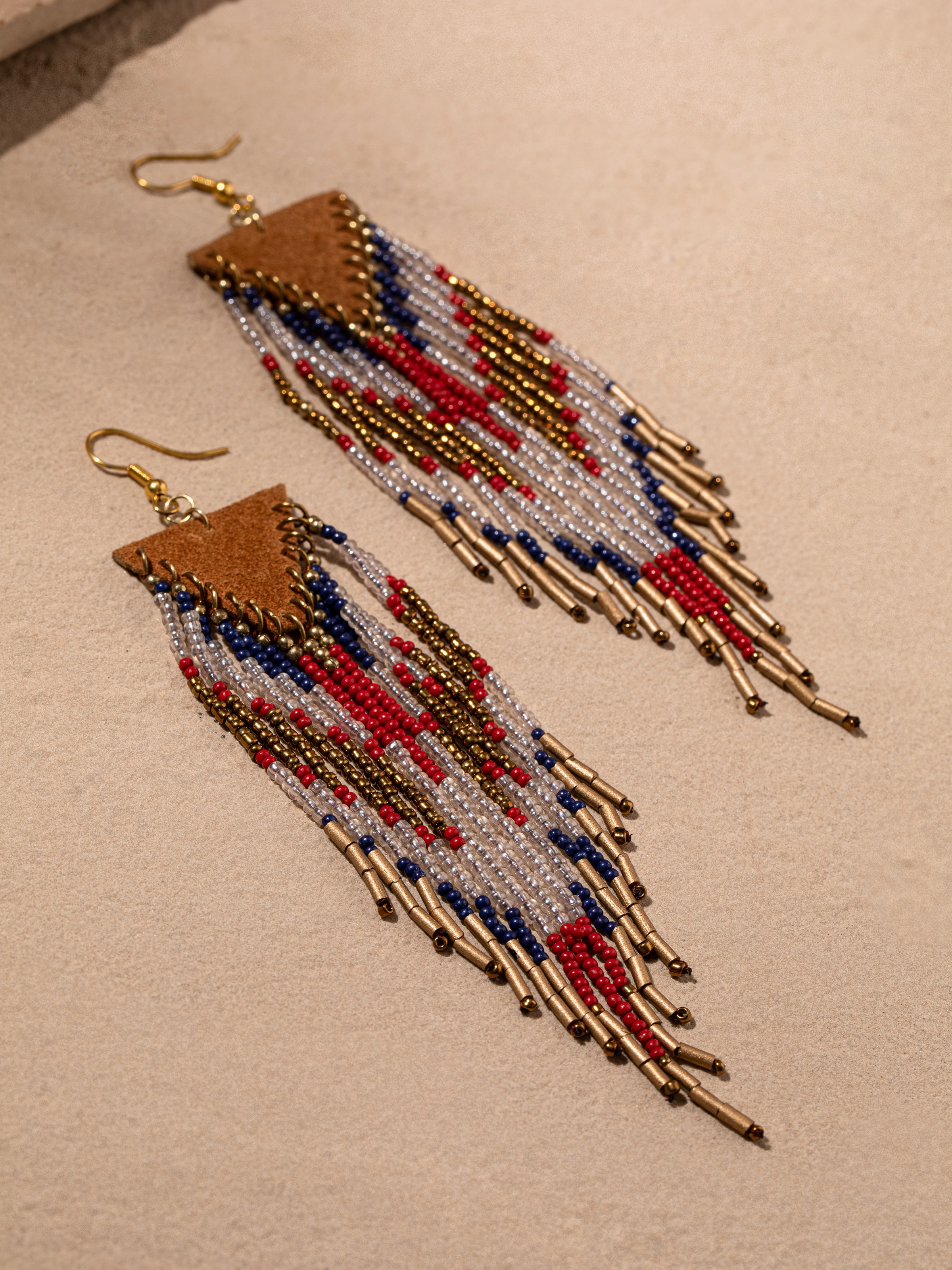 Back view of handcrafted drop earrings showing the secure clasp and overall design.
