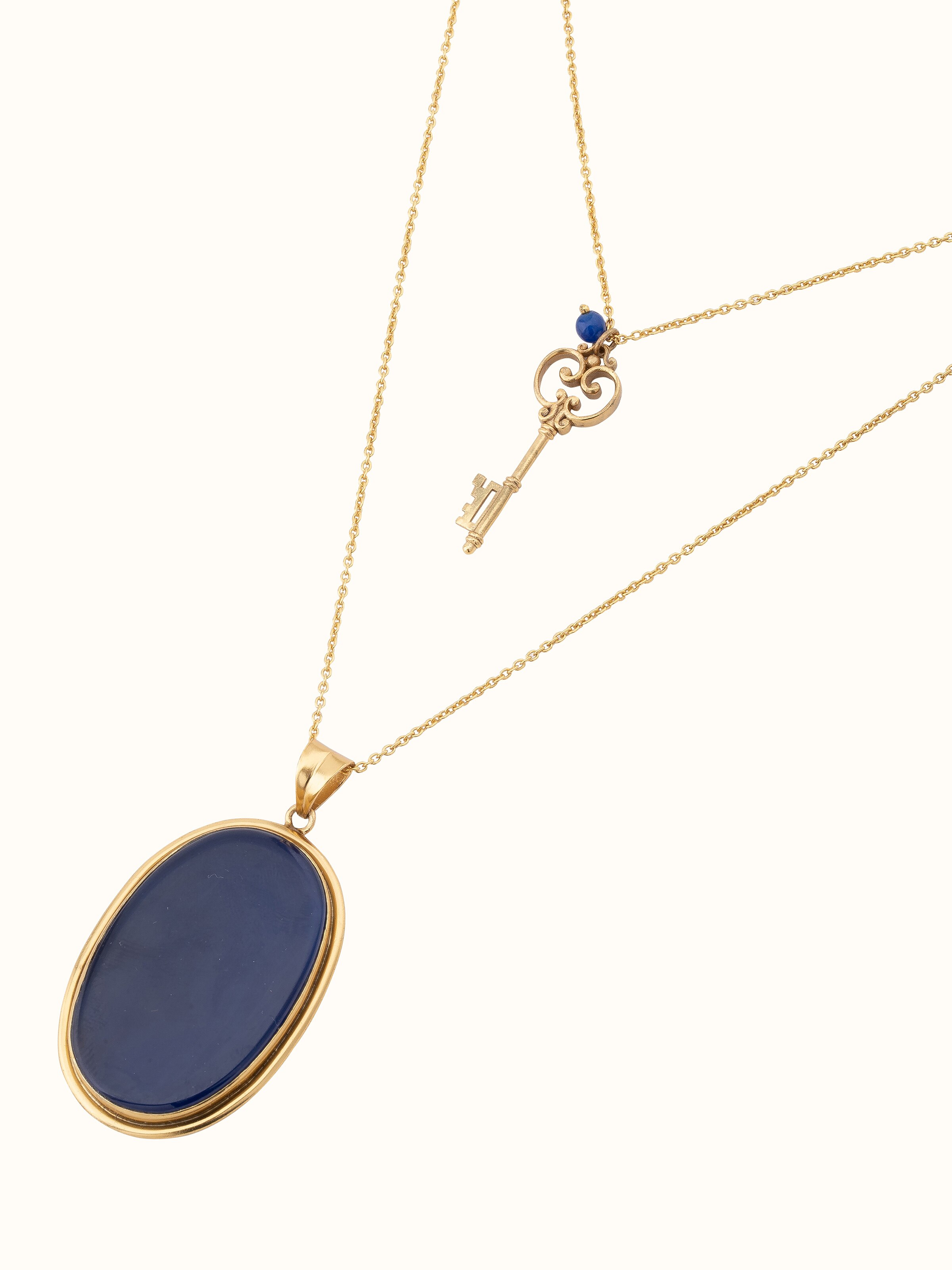 Angled view of Agate Pendant with Chain showcasing the detailed pendant and chain design.