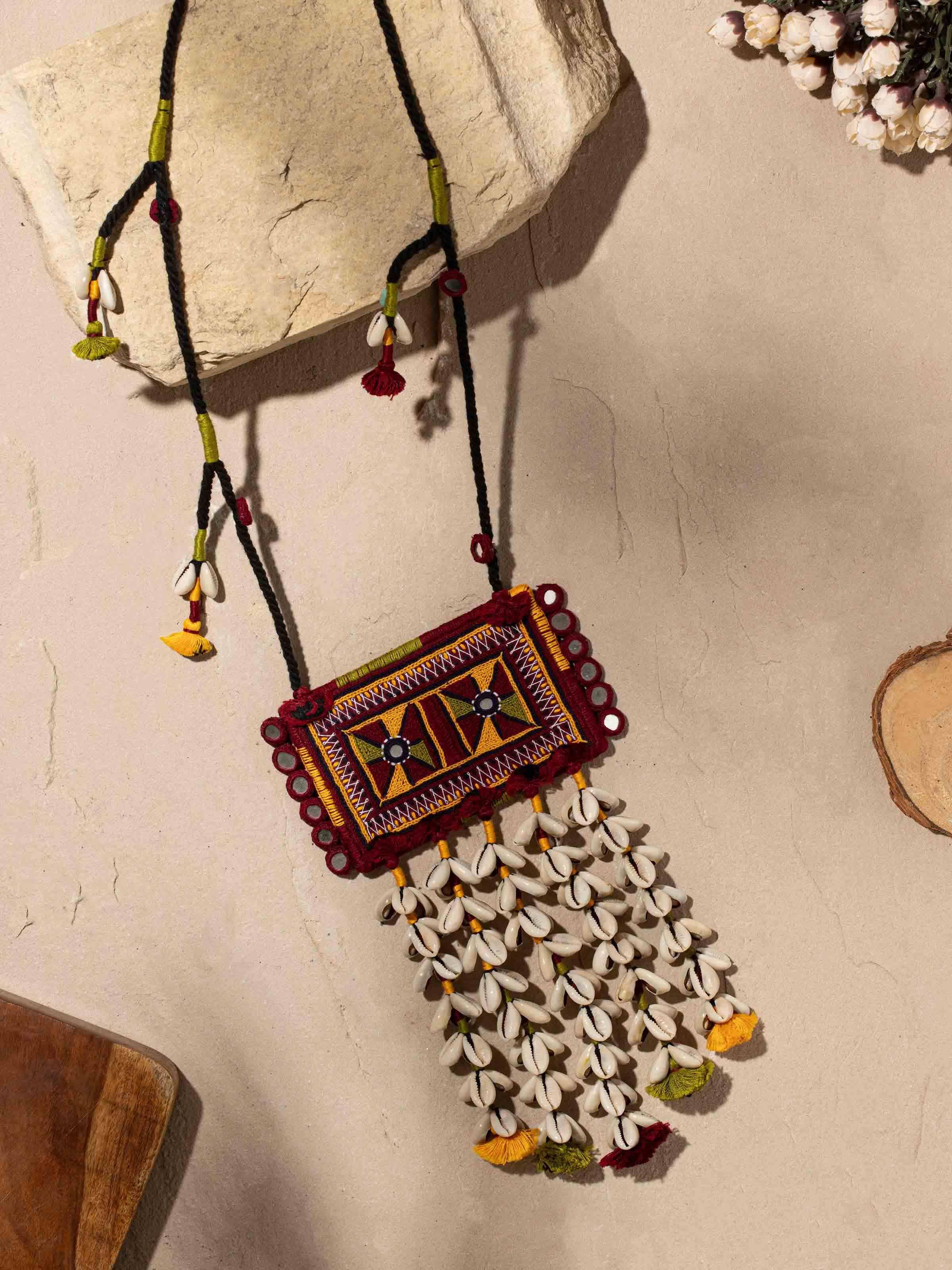 Close-up of Banjara embroidery long necklace revealing its traditional craftsmanship and vibrant hues.