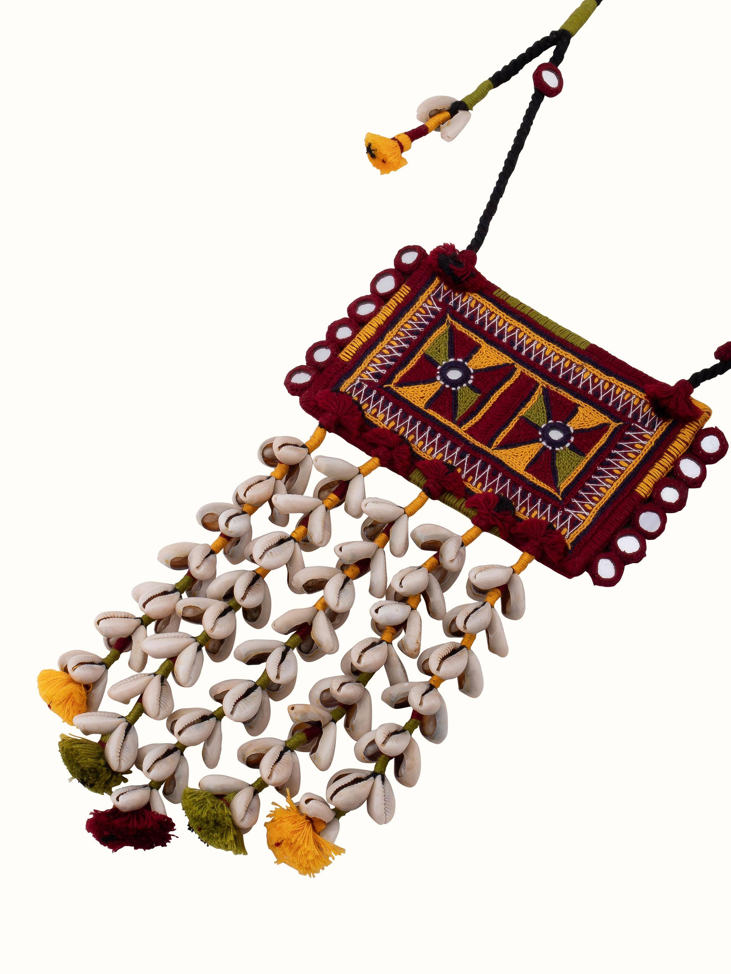 Overhead view of Banjara embroidery long necklace displaying its full length and ornate design.