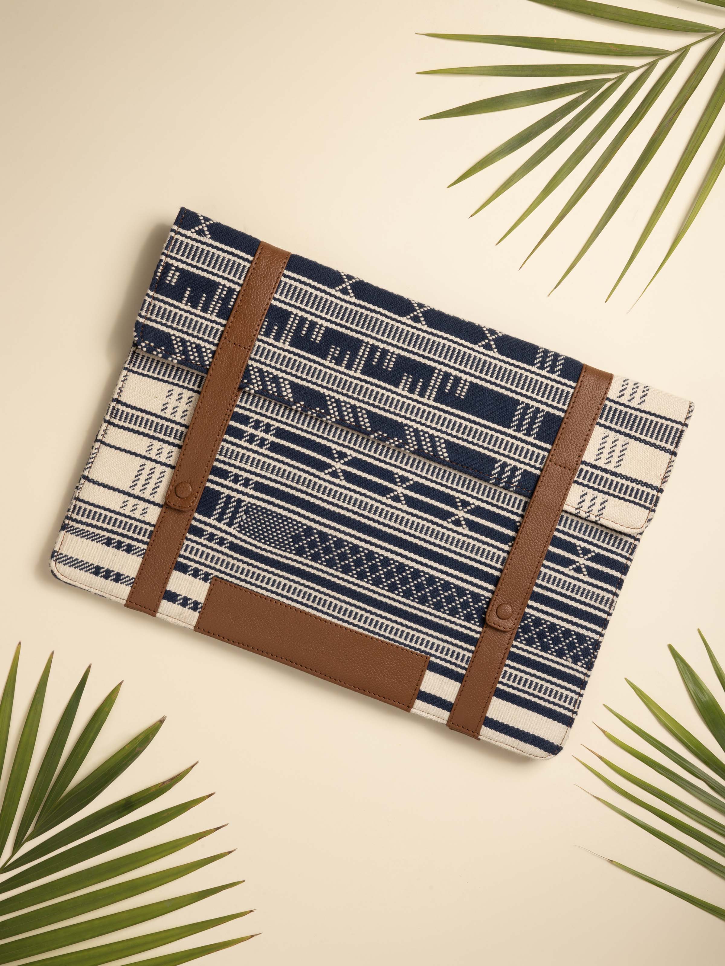 Side view of leather and textile laptop sleeve emphasizing the craftsmanship and functional design