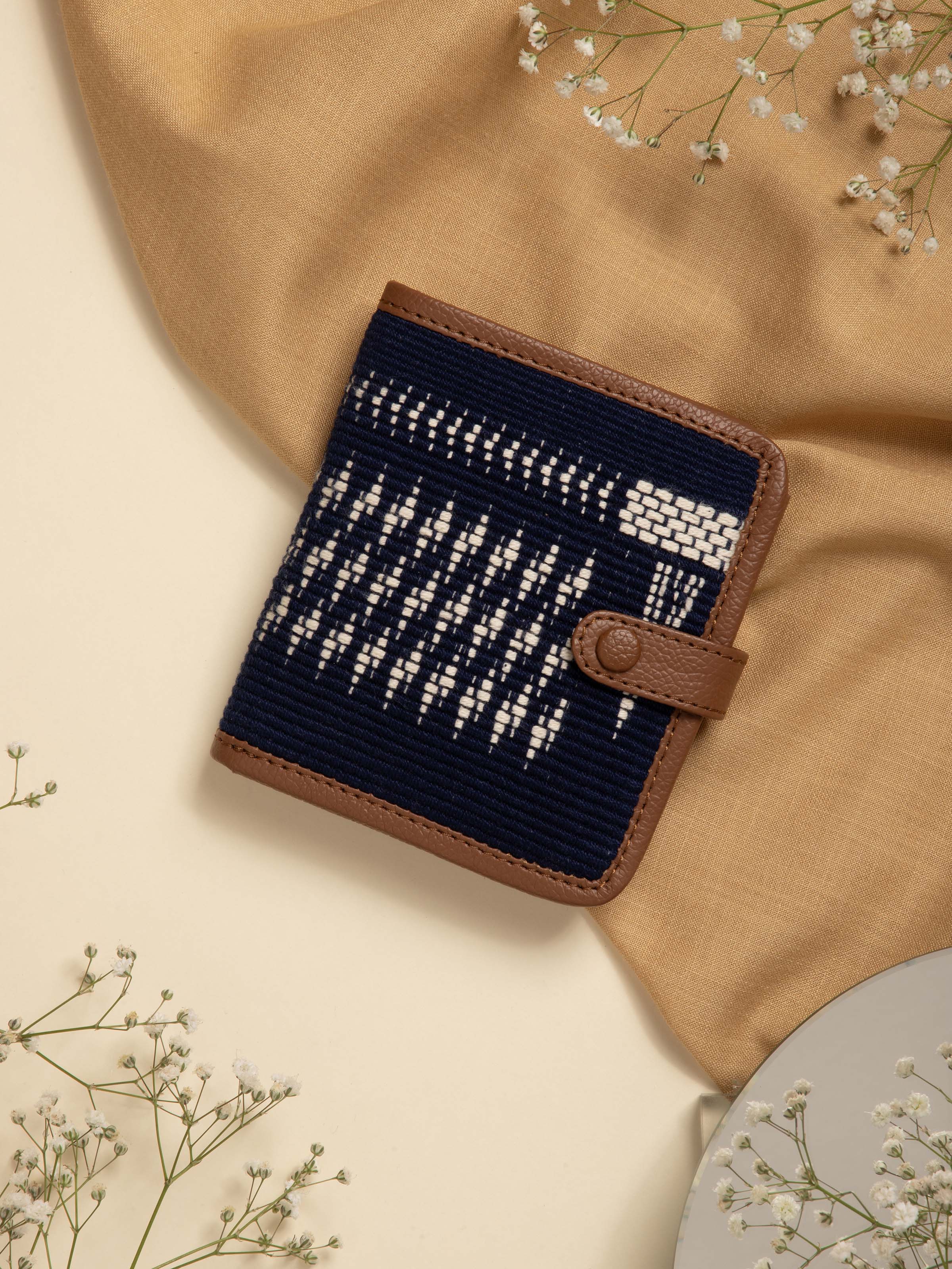 Side view of leather and textile Nagaland loin loom wallet highlighting craftsmanship and design