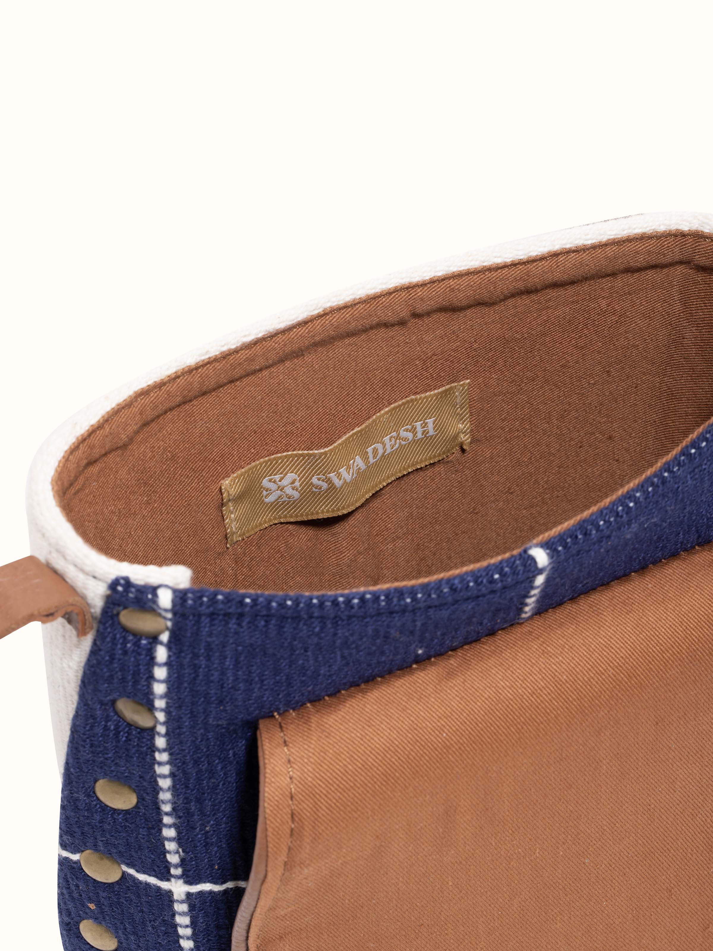 Detailed view of leather & textile Nagaland loin loom sling bag emphasizing craftsmanship