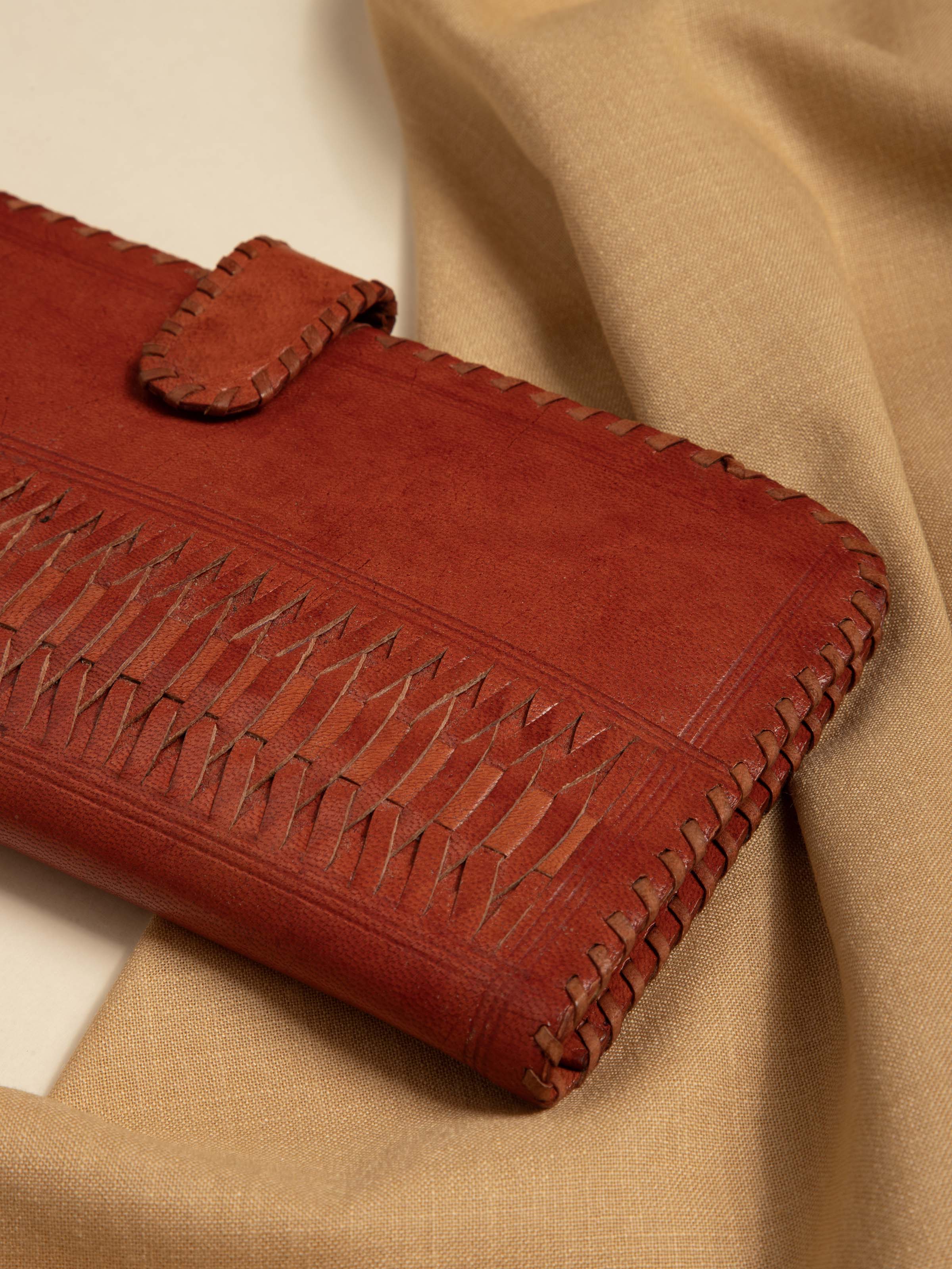 Close-up view of Tan Leather Kutch Stitched Long Wallet highlighting embroidery and leather texture.