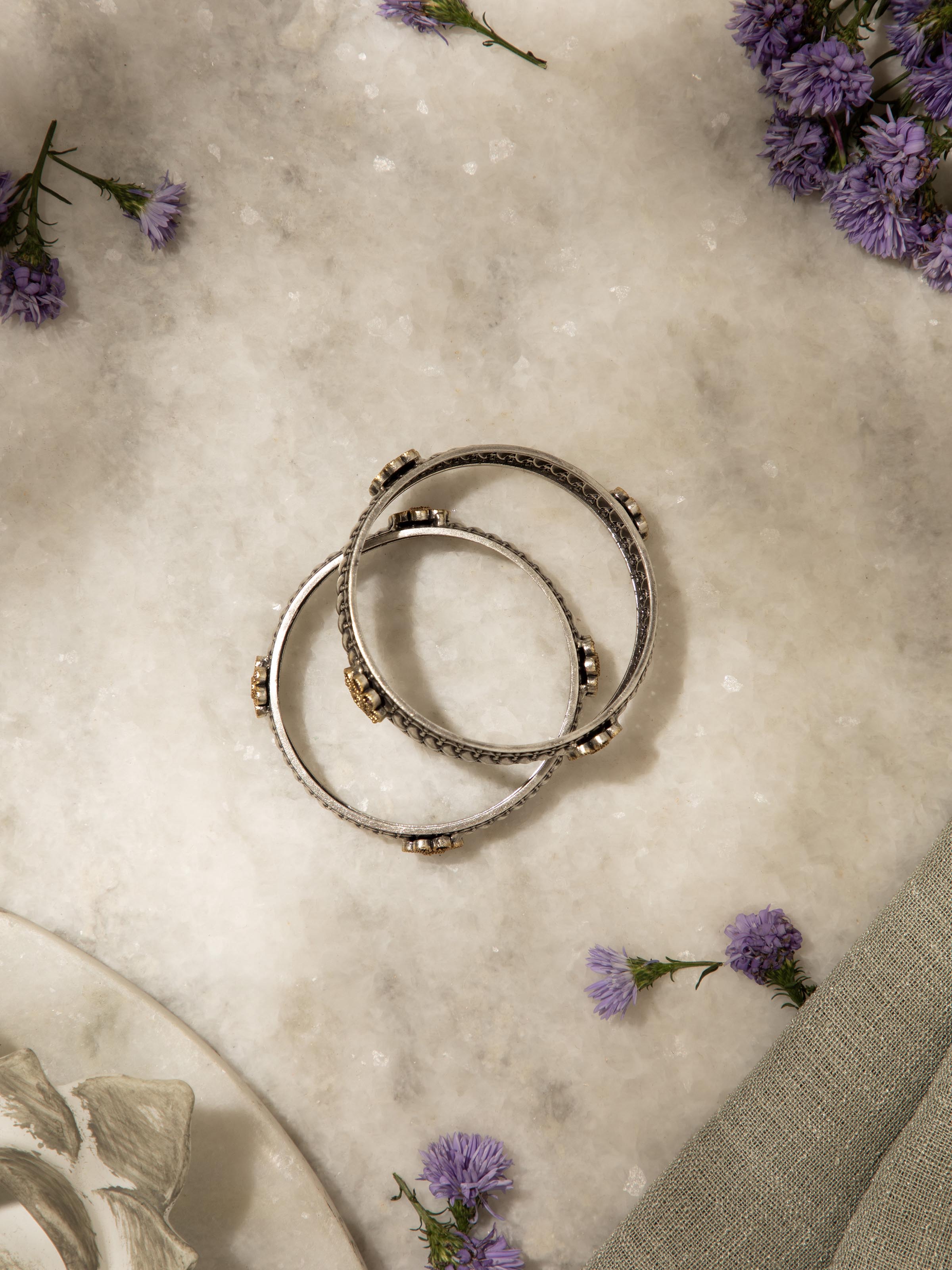 Angled view of Silver Smithing bangle showcasing elegant curves and sophisticated design