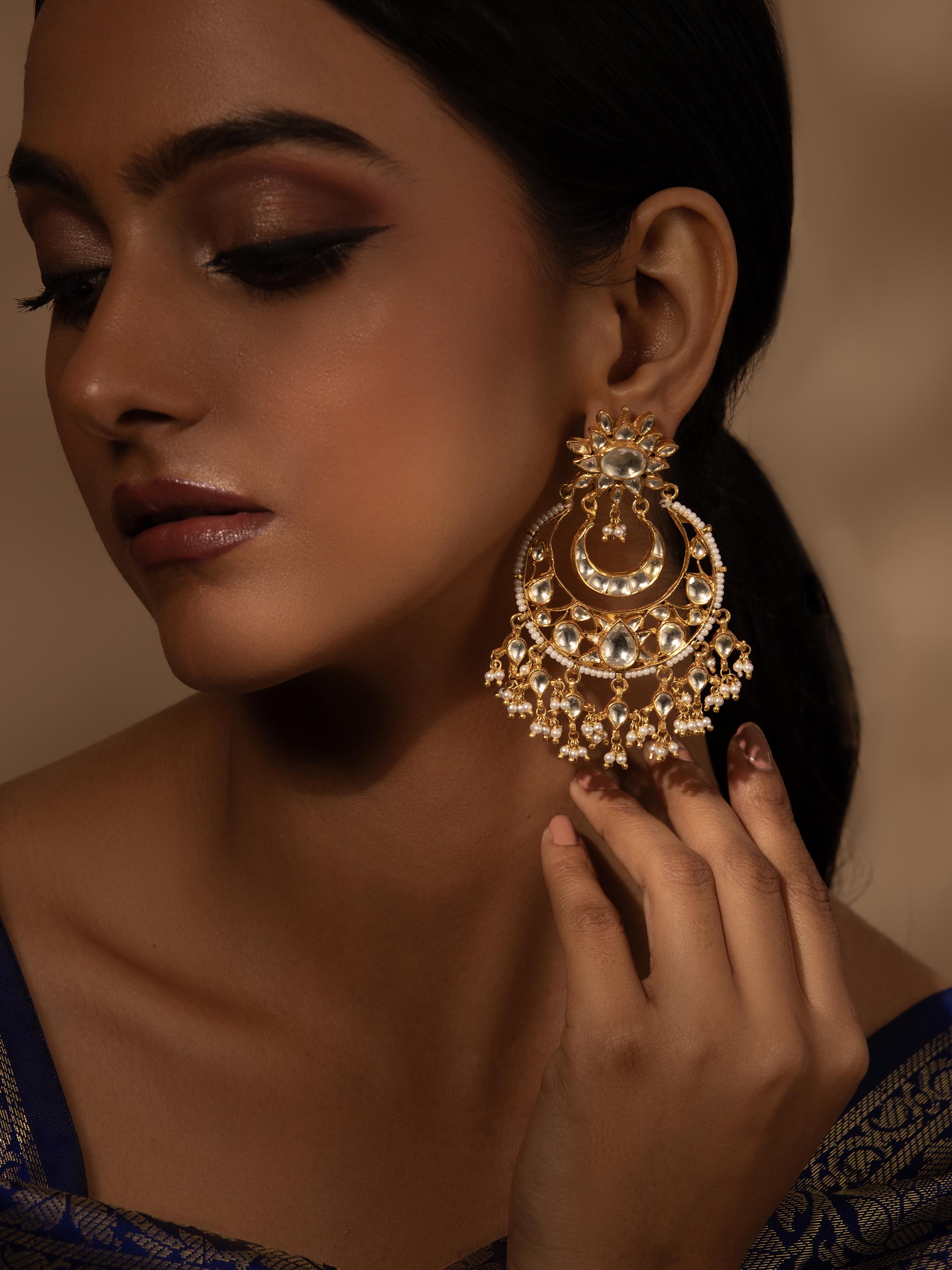 Close-up view of Silver Smithing Chandbalis focusing on the fine detailing and silver craftsmanship.