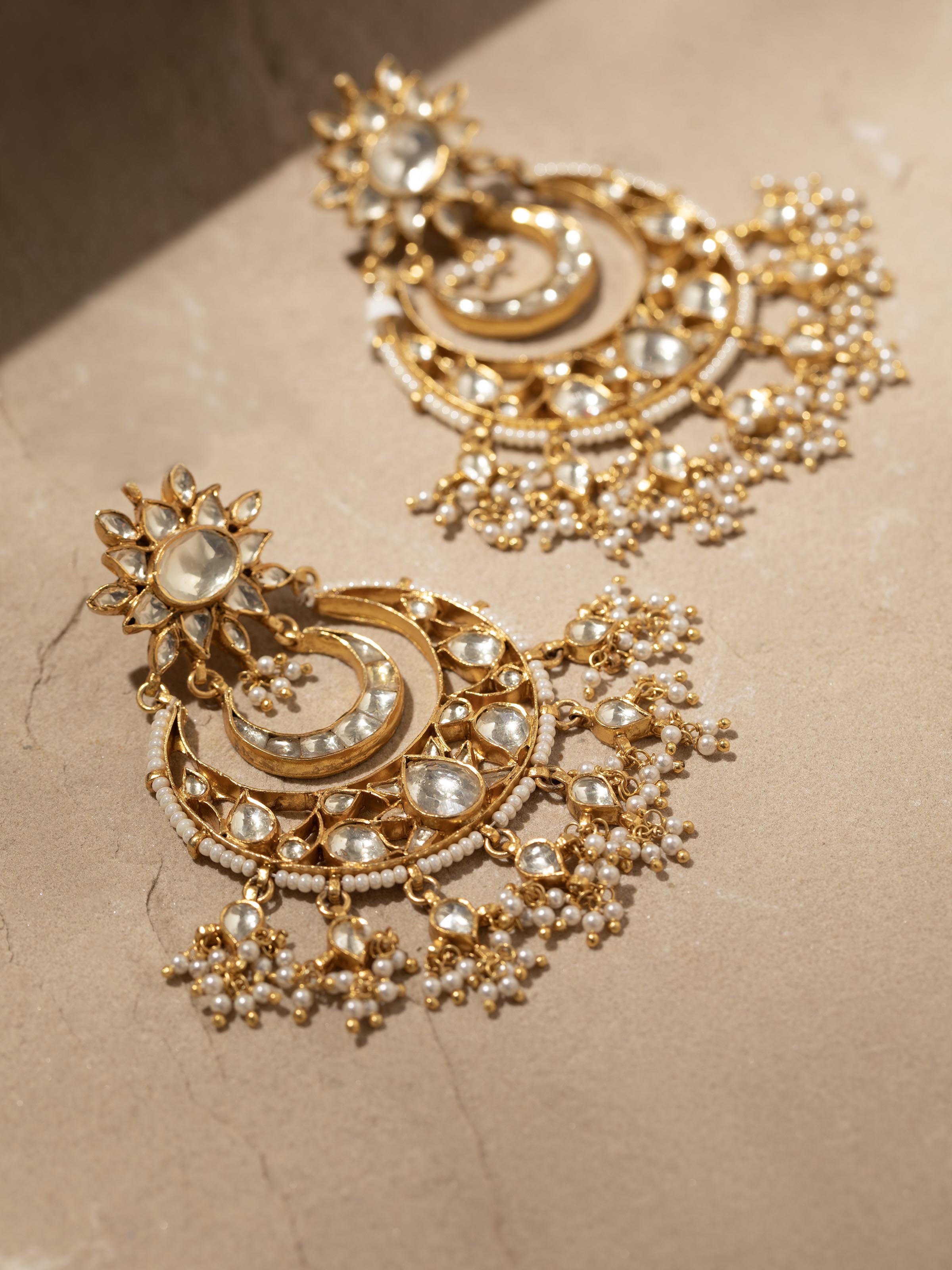 Angled view of Silver Smithing Chandbalis highlighting the design intricacies and elegant silverwork.