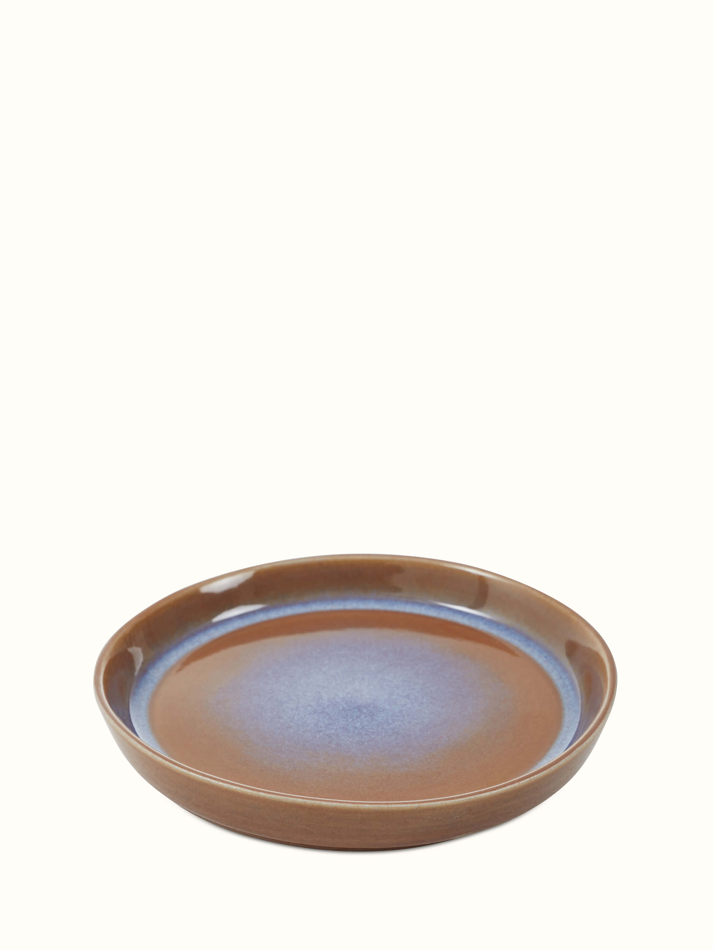 Close-up view of Khurja pottery ceramic salad plates showcasing the brown glaze and intricate design.