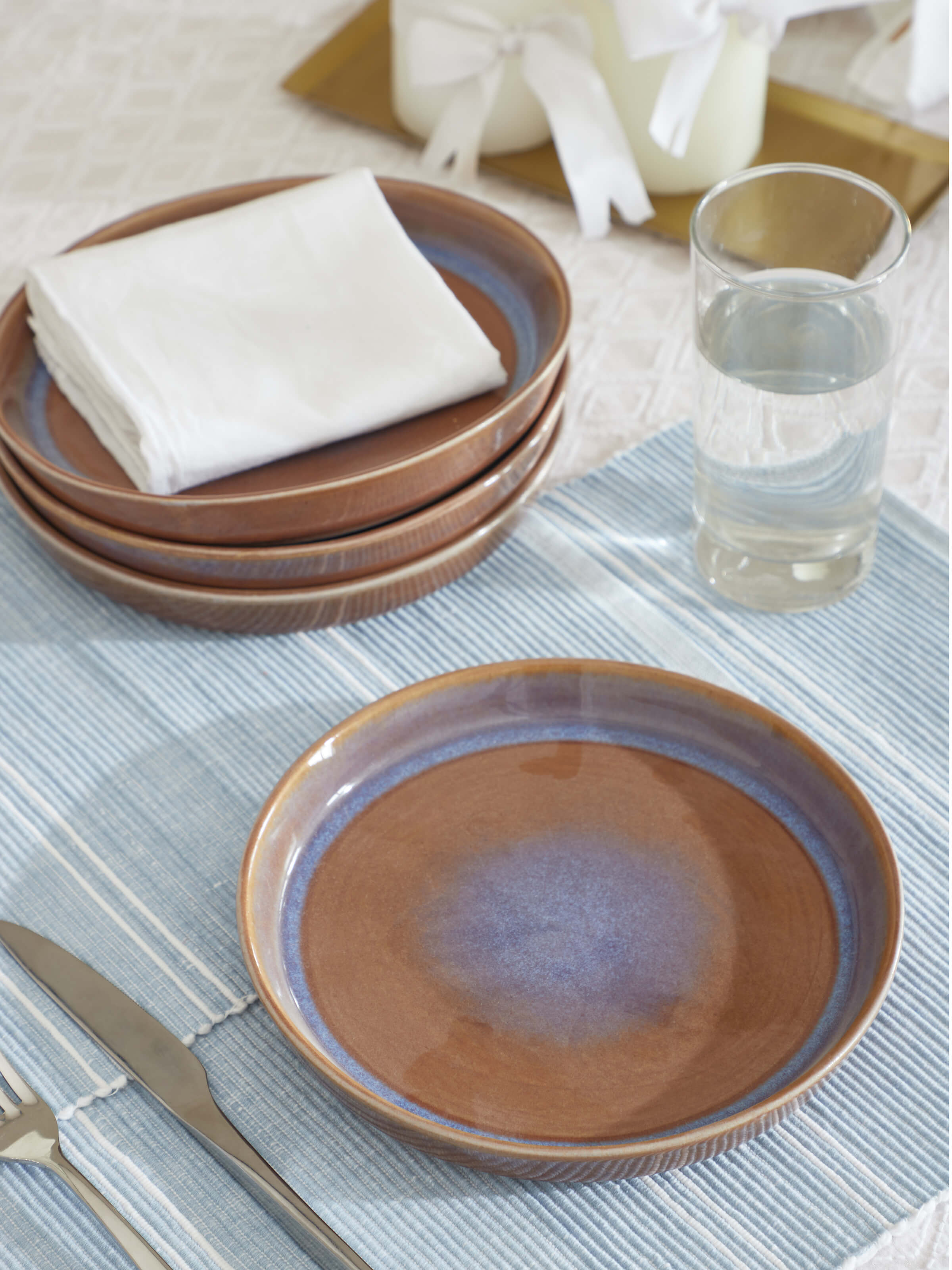 Angle view of Khurja pottery ceramic salad plates showing the detailed craftsmanship and design.