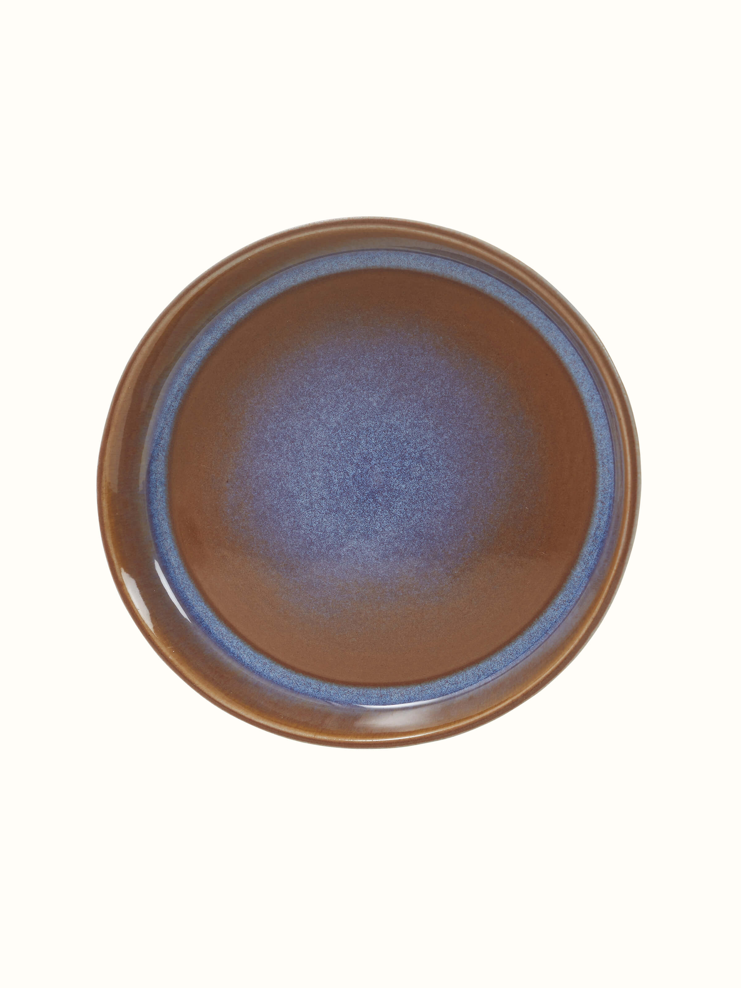 Side view of Khurja pottery ceramic salad plates emphasizing the plate's depth and traditional pattern.