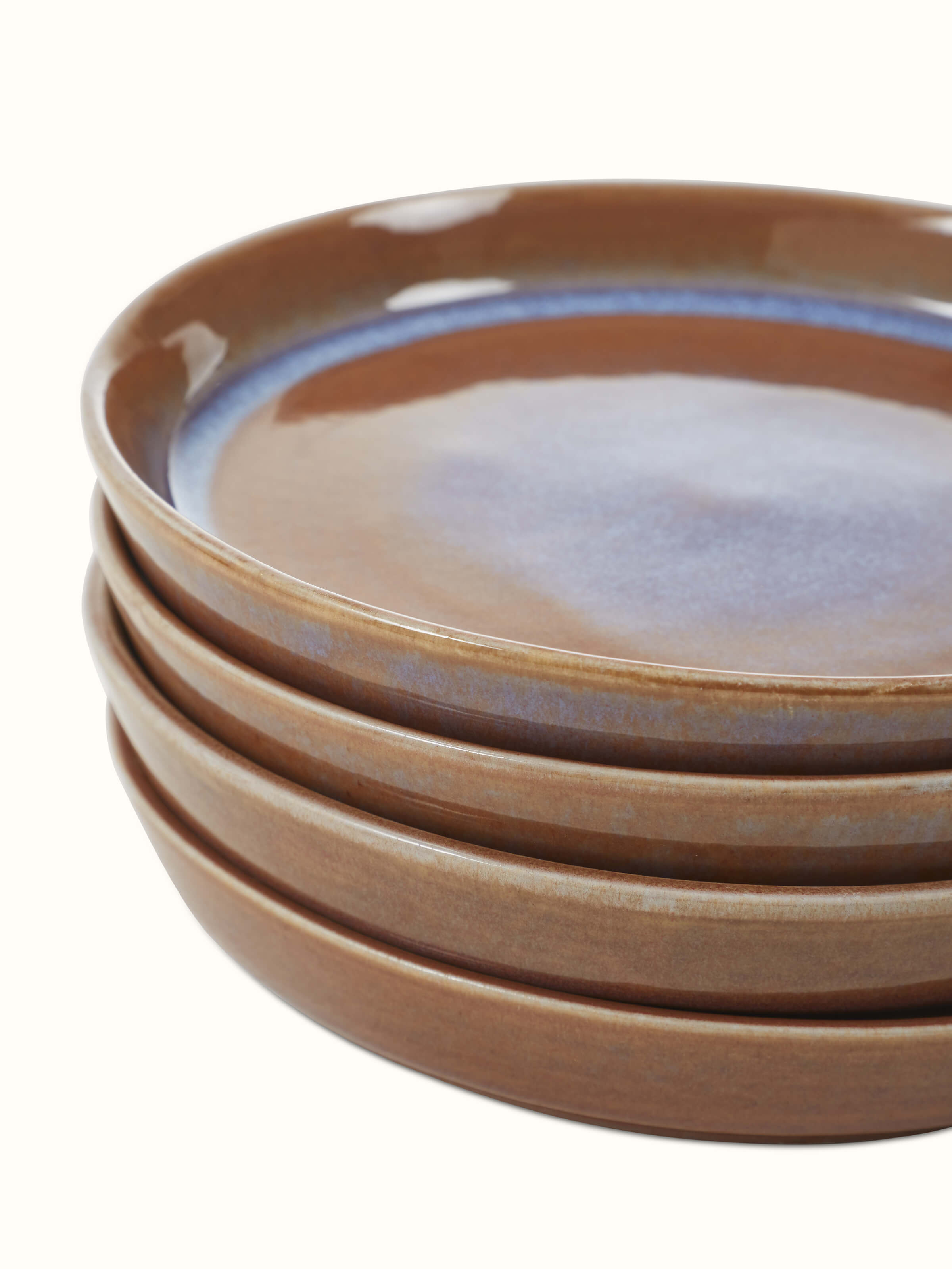 Top view of Khurja pottery ceramic salad plates in brown, highlighting the plate's smooth finish and traditional pattern.