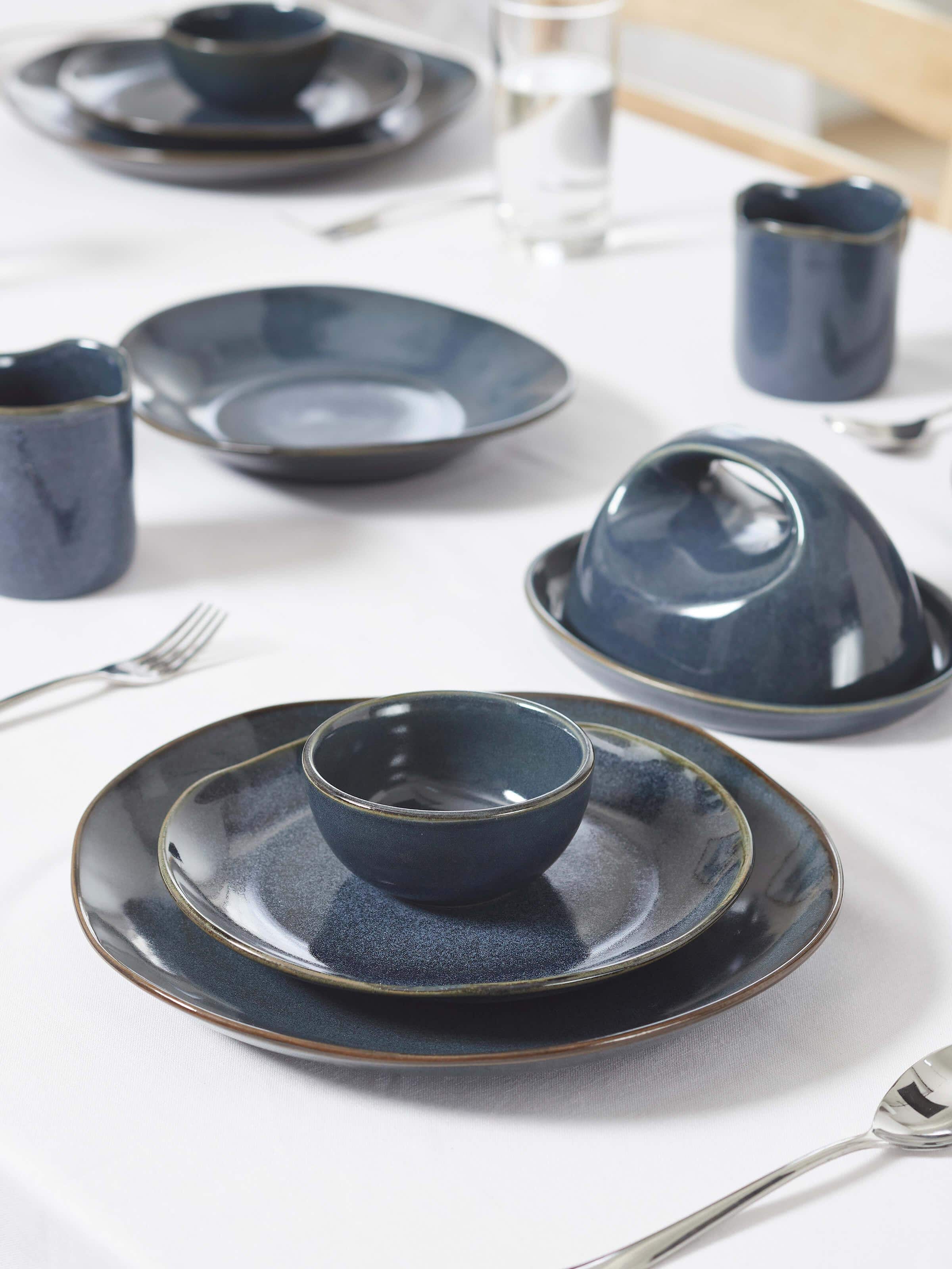 Angled view of Khurja pottery ceramic dinner bowl set (4 pcs) highlighting the vibrant colors and detailed ceramic design