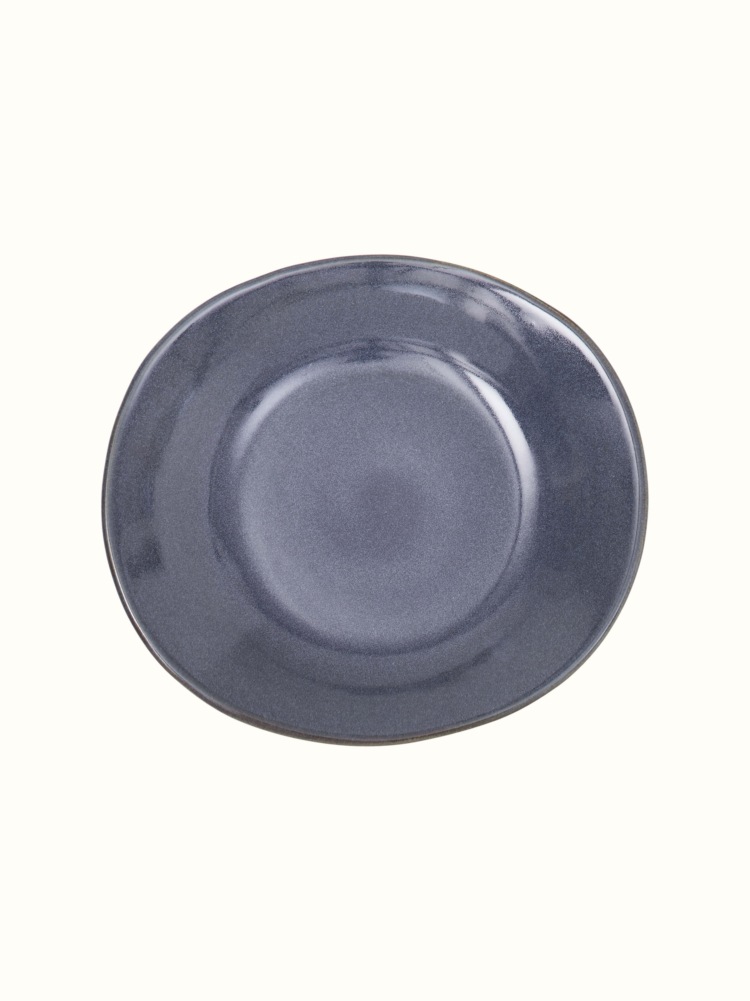 Close-up view of Khurja pottery ceramic serving bowl black focusing on the sleek black glaze and intricate ceramic work