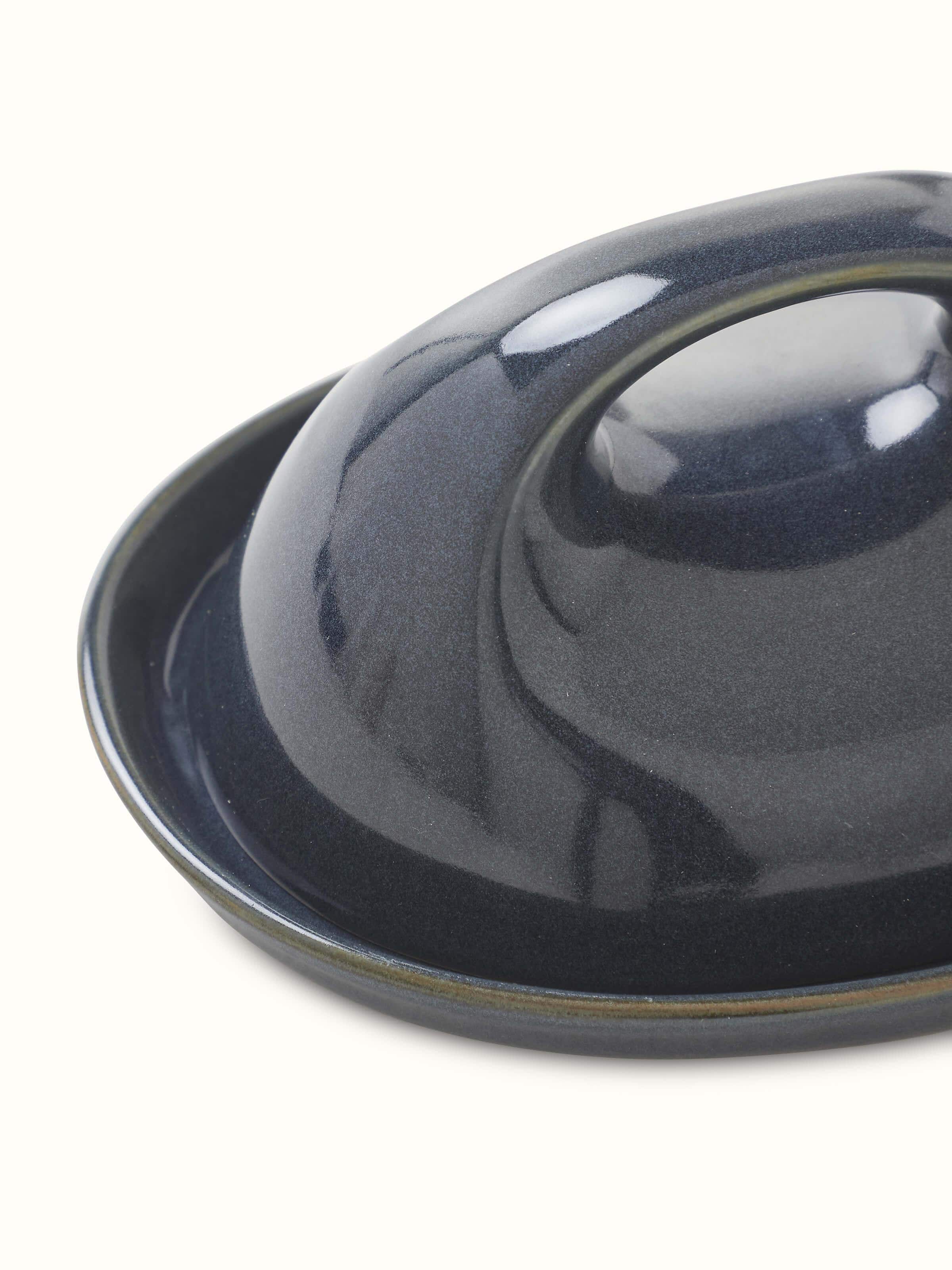 Antique brass dhokra peacock diya with intricate detailing and traditional design.