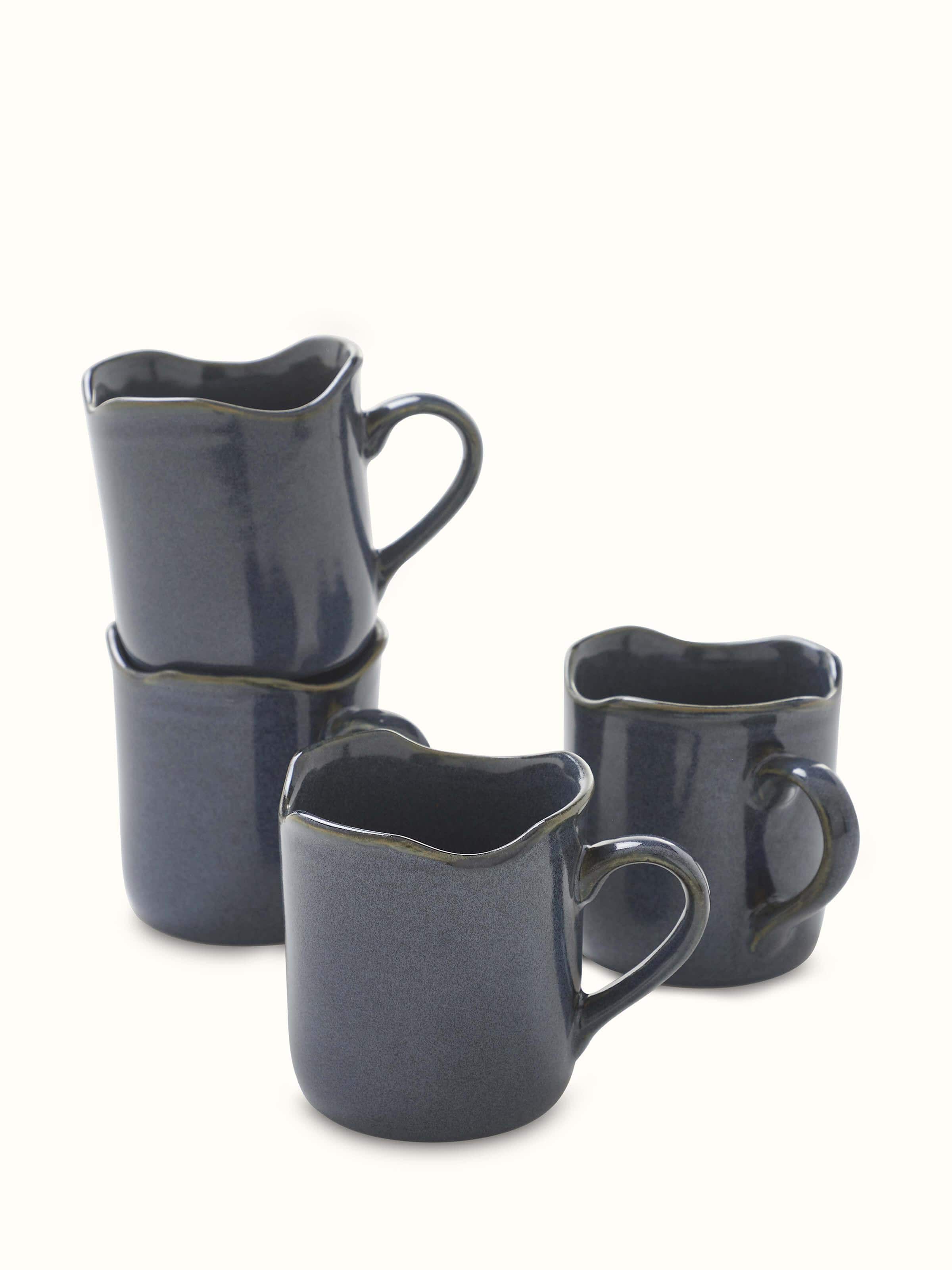 Front view of Khurja pottery ceramic simple coffee mugs in black showcasing the minimalist design and smooth finish
