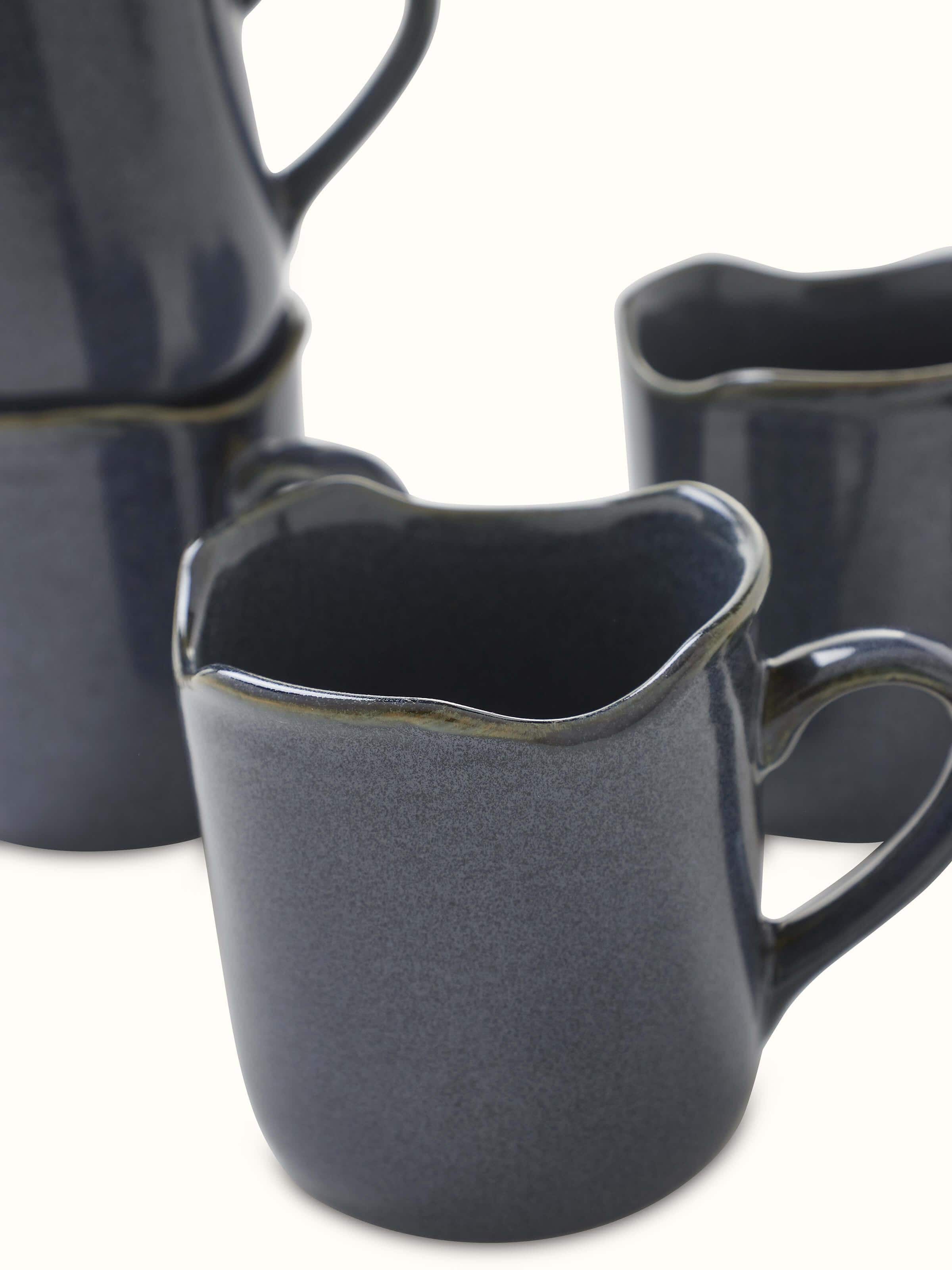Detailed view of Khurja pottery ceramic simple coffee mugs in black showcasing the durability and design features