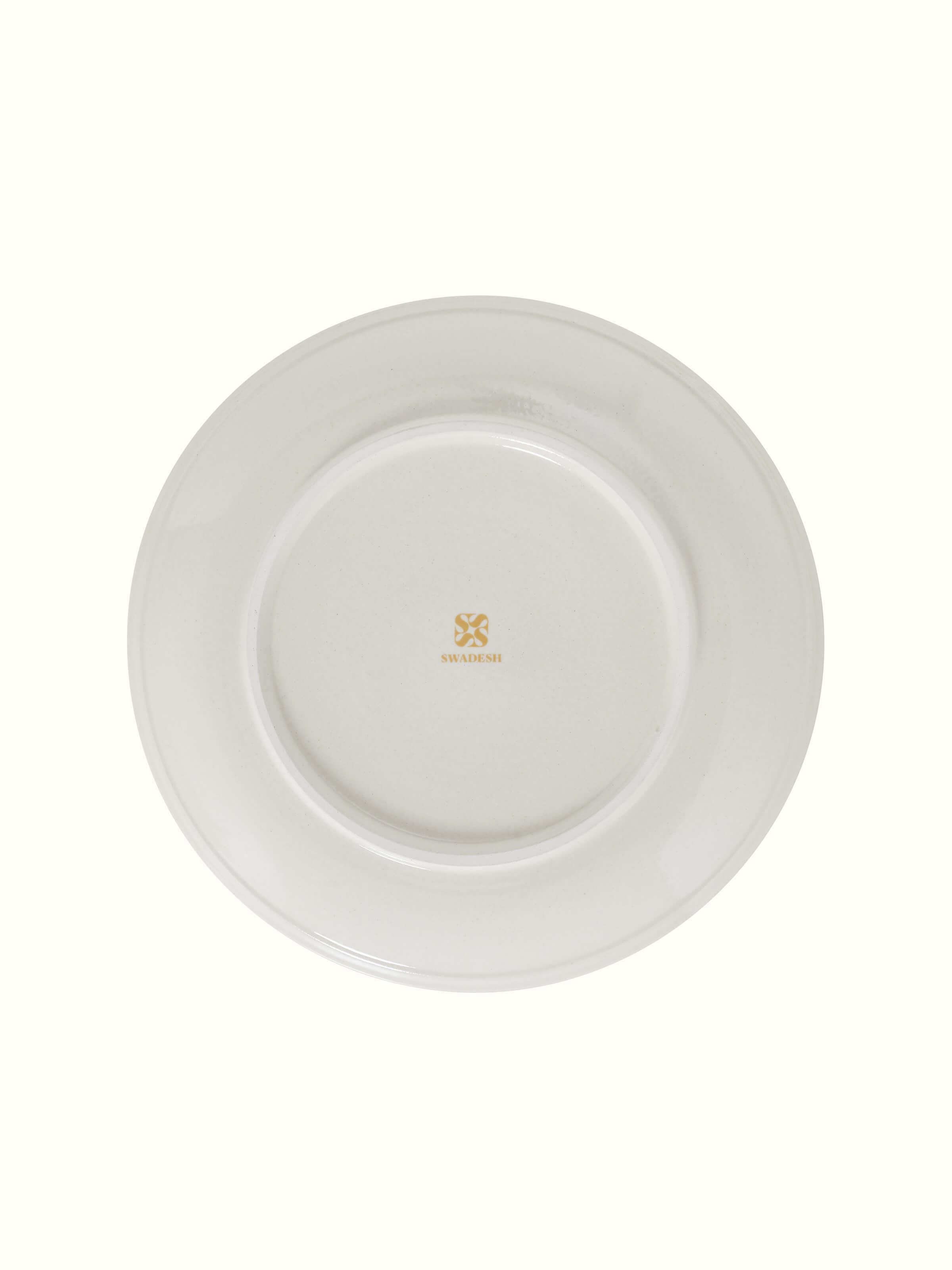 Angled view of Khurja Pottery Ceramic Dinner Plates in Orange & White showcasing design details.