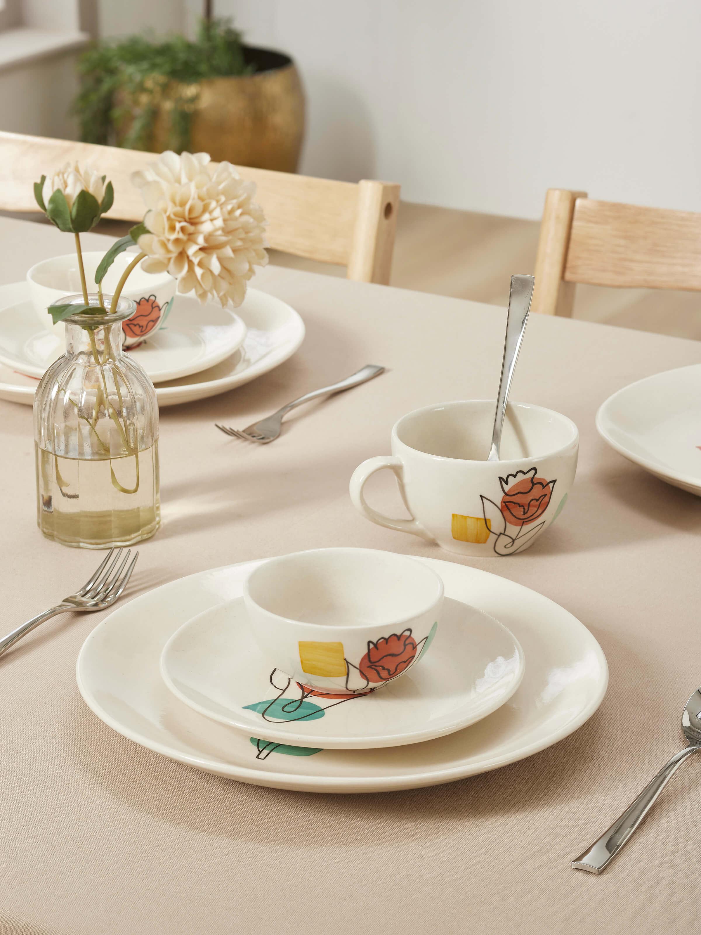 Close-up of Khurja Pottery Ceramic Dinner Plates in Orange & White showcasing detailed patterns.