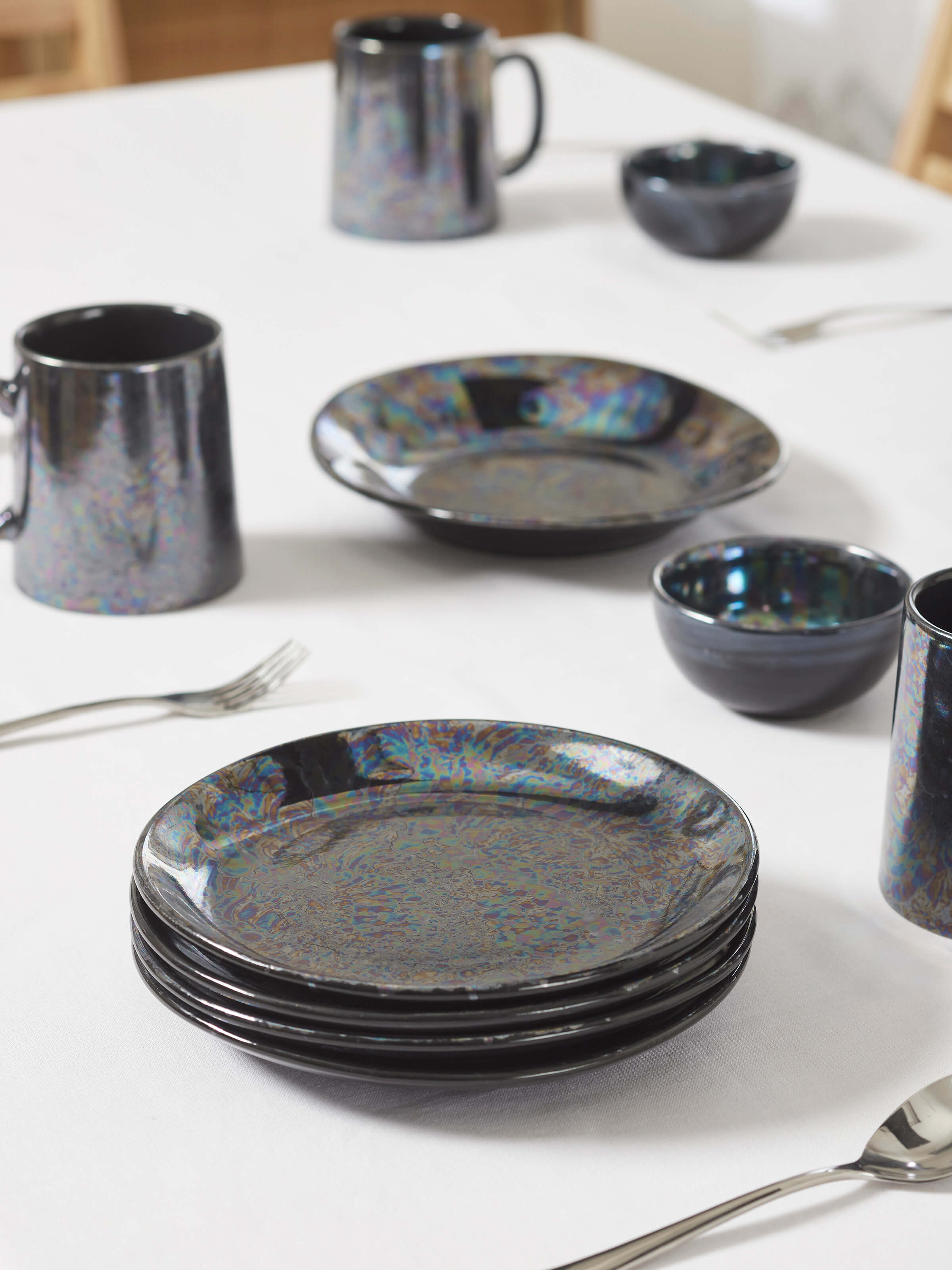 Angled view of Khurja Pottery Ceramic Salad Plates in black, displaying the plate's form and elegant design