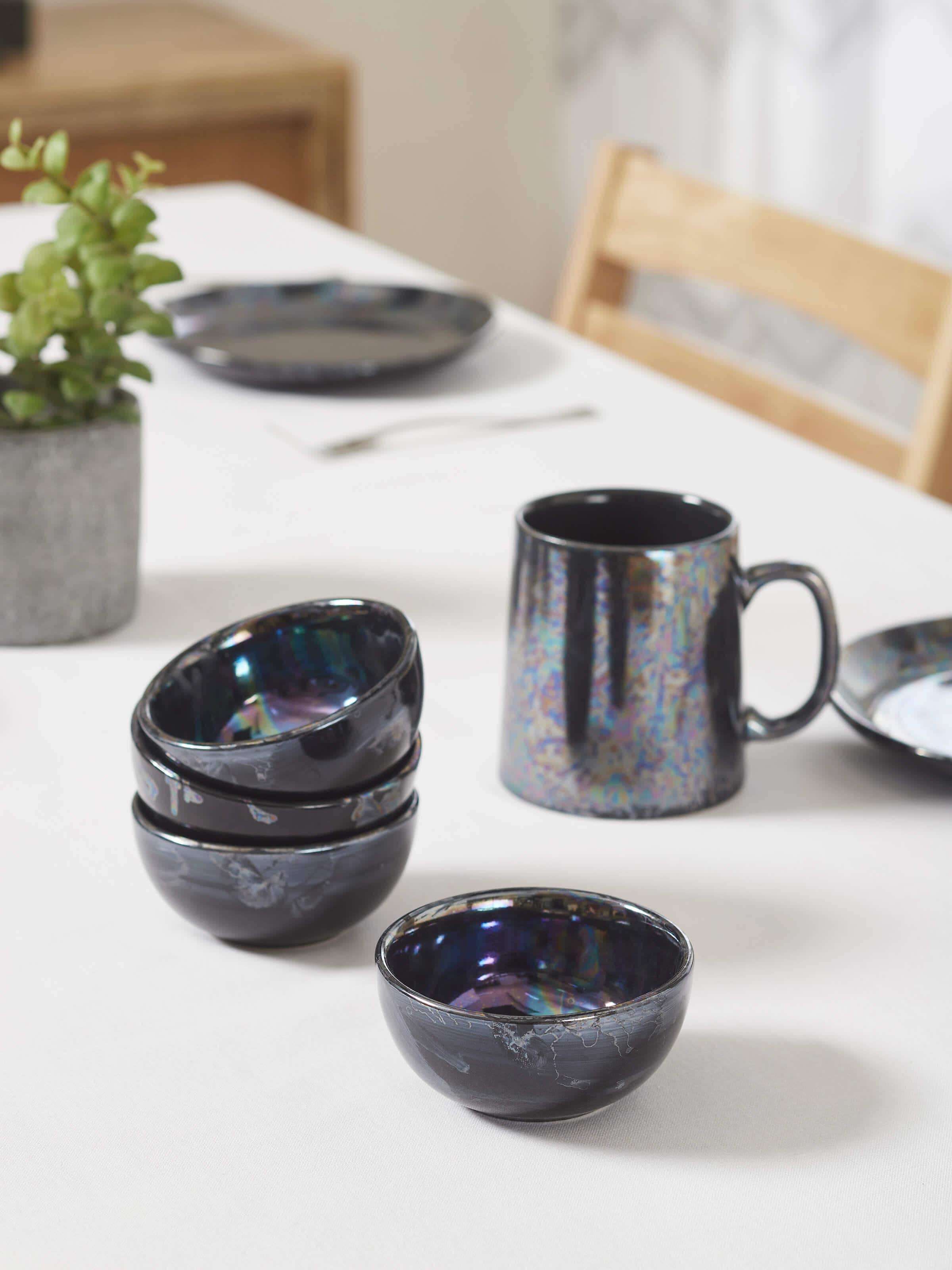Side view of black Khurja pottery ceramic dinner bowls, set of 4, highlighting the craftsmanship and glossy texture.