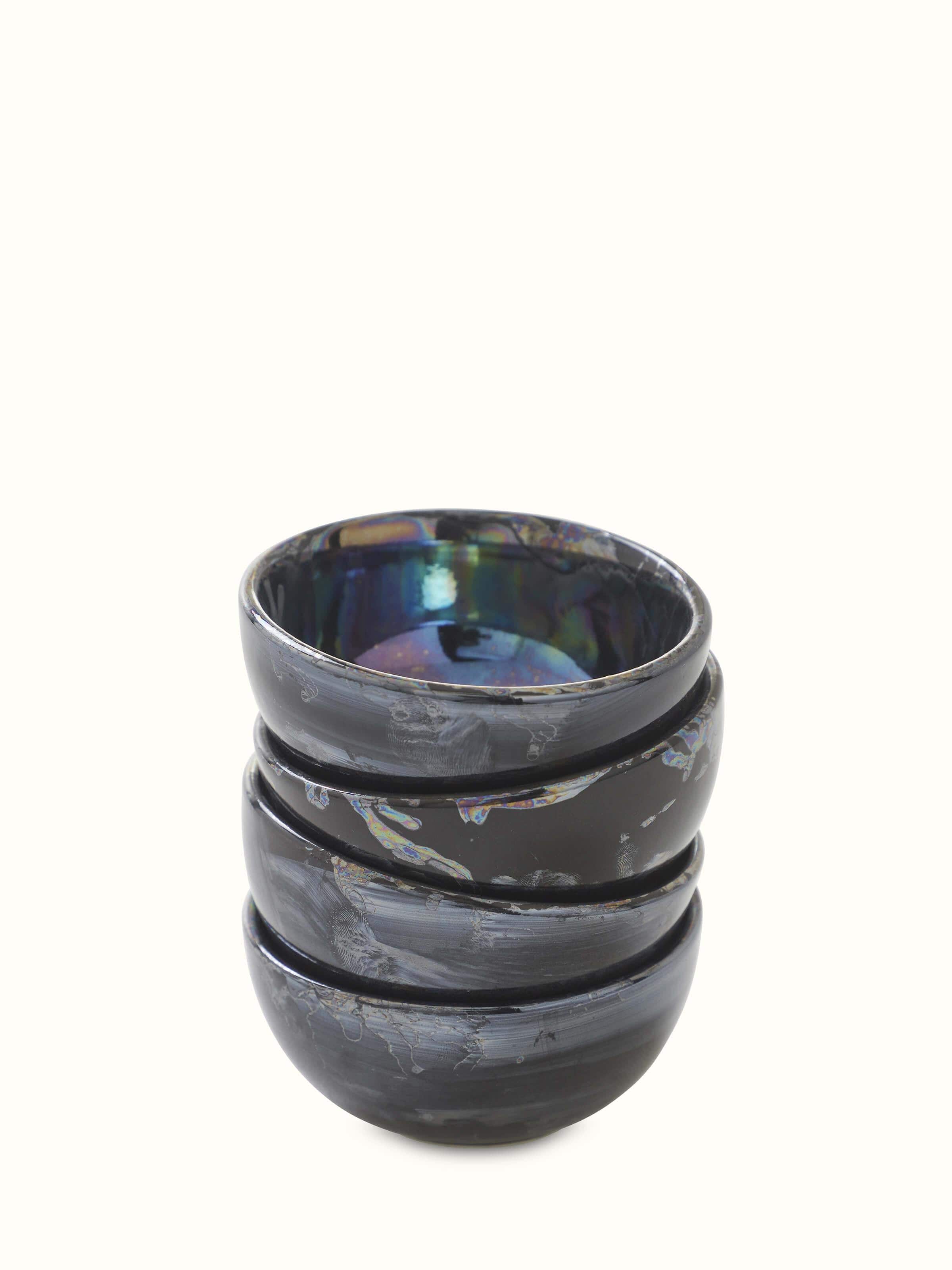 Front view of black Khurja pottery ceramic dinner bowls, set of 4, with glossy finish showcasing intricate design.