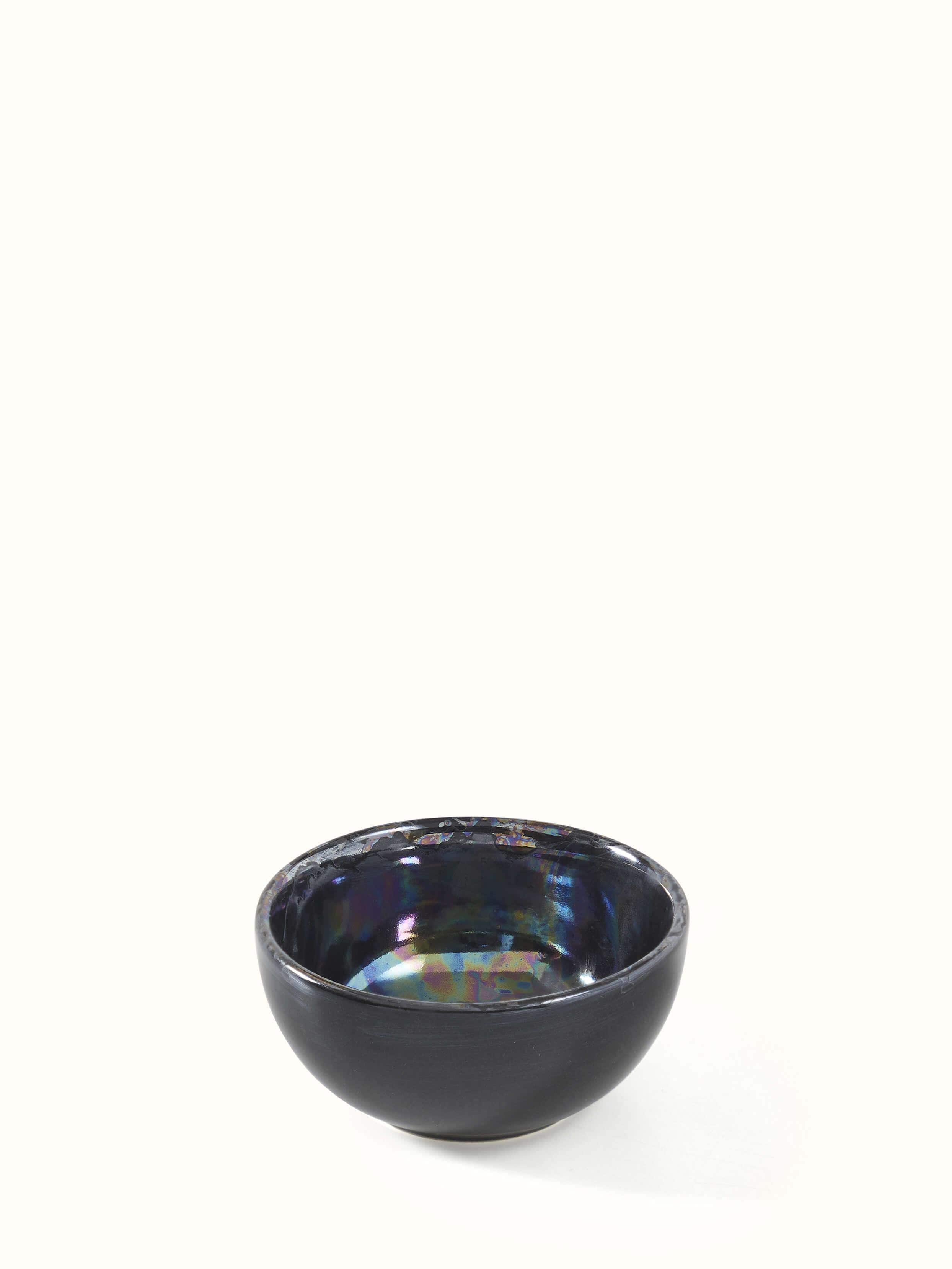 Artistic view of black Khurja pottery ceramic dinner bowls, highlighting the design details and handcrafted quality.