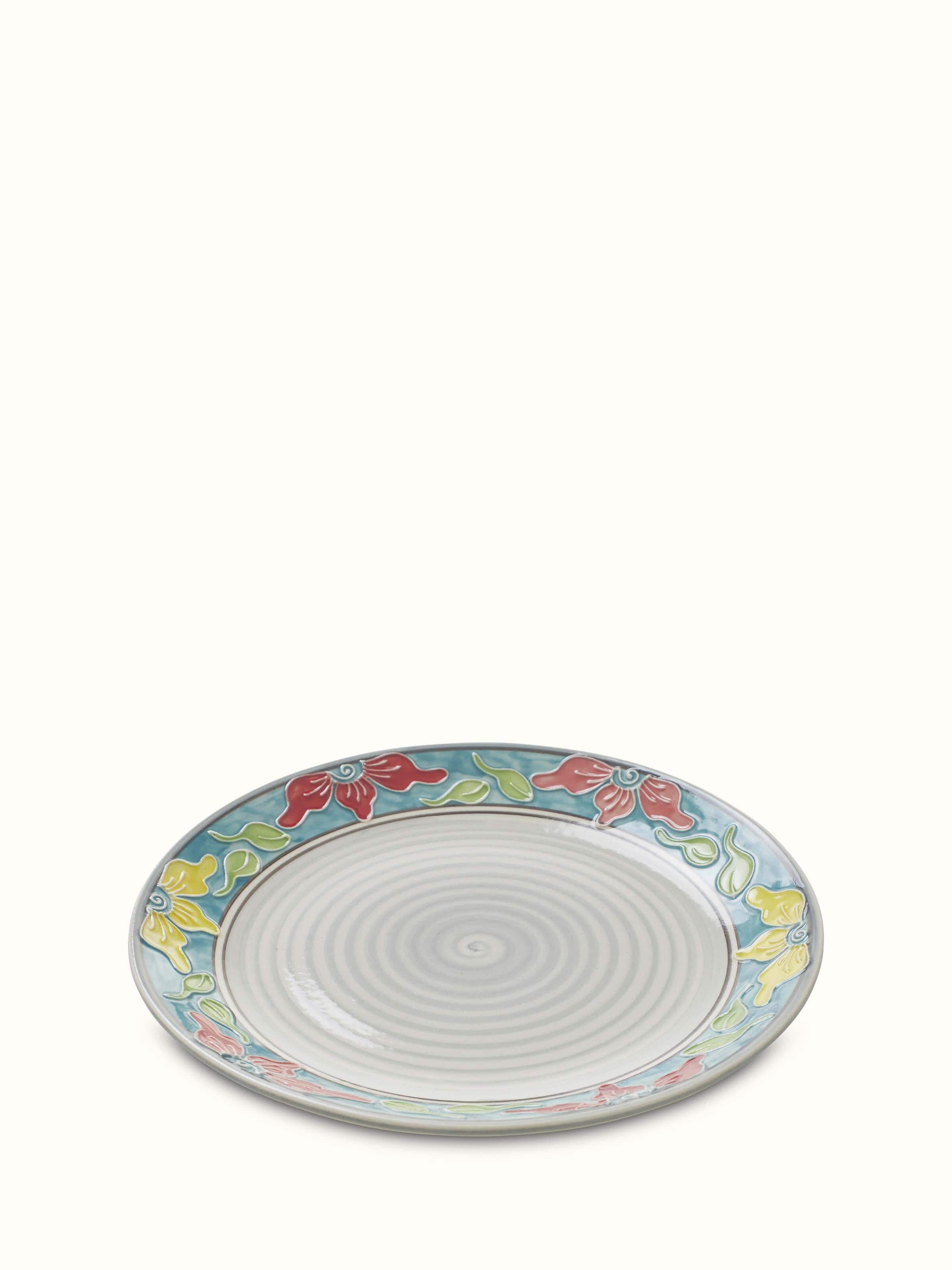 Detailed view of Khurja pottery ceramic dinner plates with blue and white patterns, emphasizing the craftsmanship, Swadesh