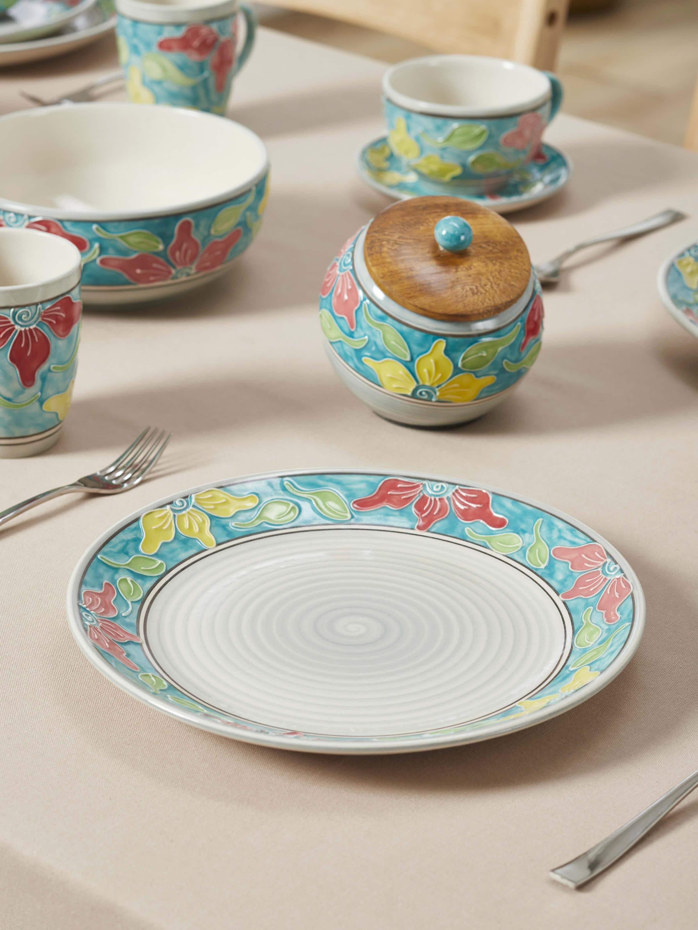 Top view of Khurja pottery ceramic dinner plates set, highlighting the detailed blue and white artwork, Swadesh