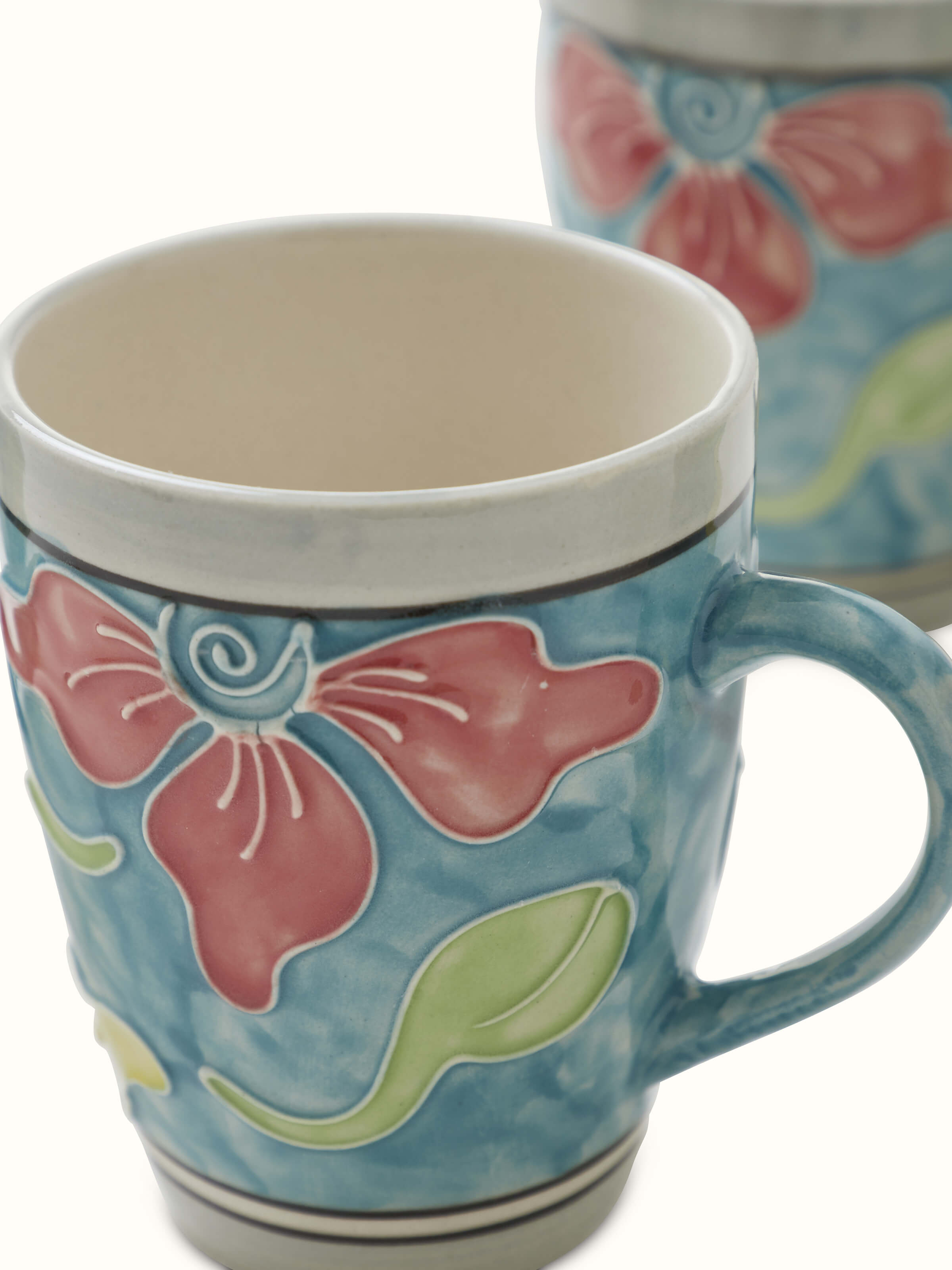 Close-up of Khurja pottery ceramic coffee mugs in blue color highlighting detail