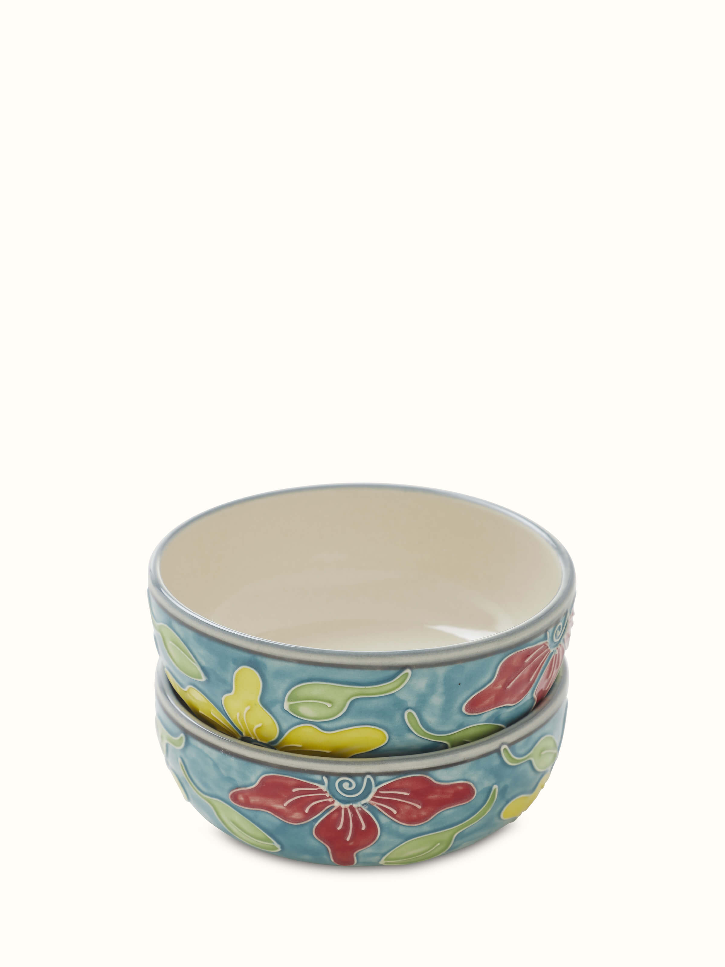 Close-up of Khurja pottery ceramic dinner bowls in blue and white, emphasizing intricate design details.