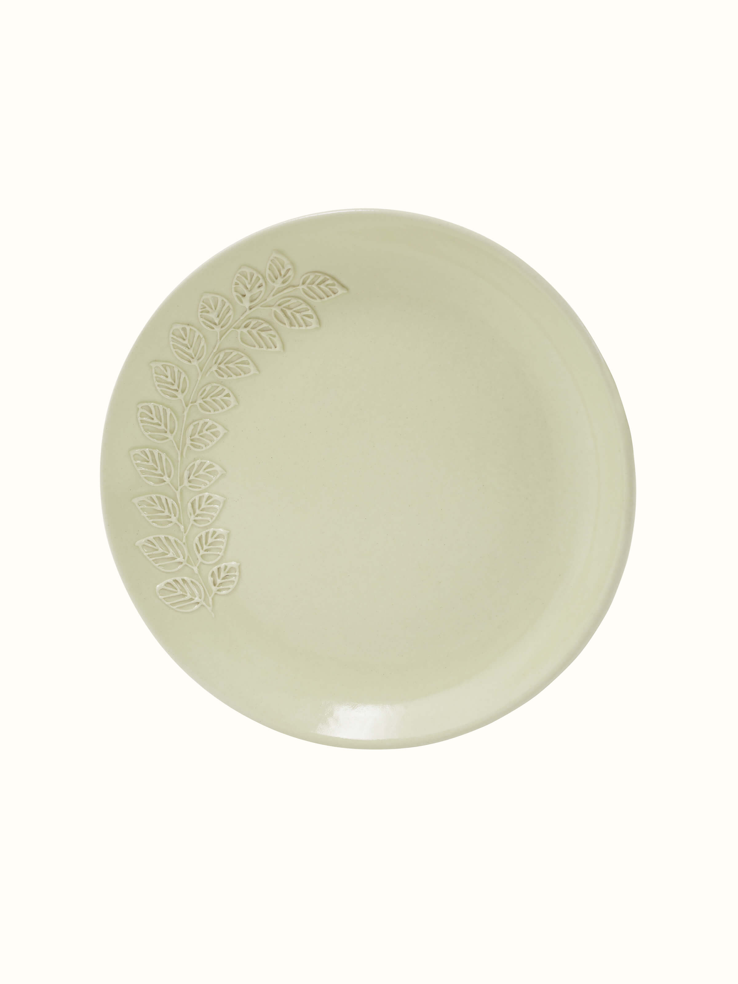 Angled view of Khurja Pottery Ceramic Salad Plates, emphasizing their elegant shape and off-white glaze.