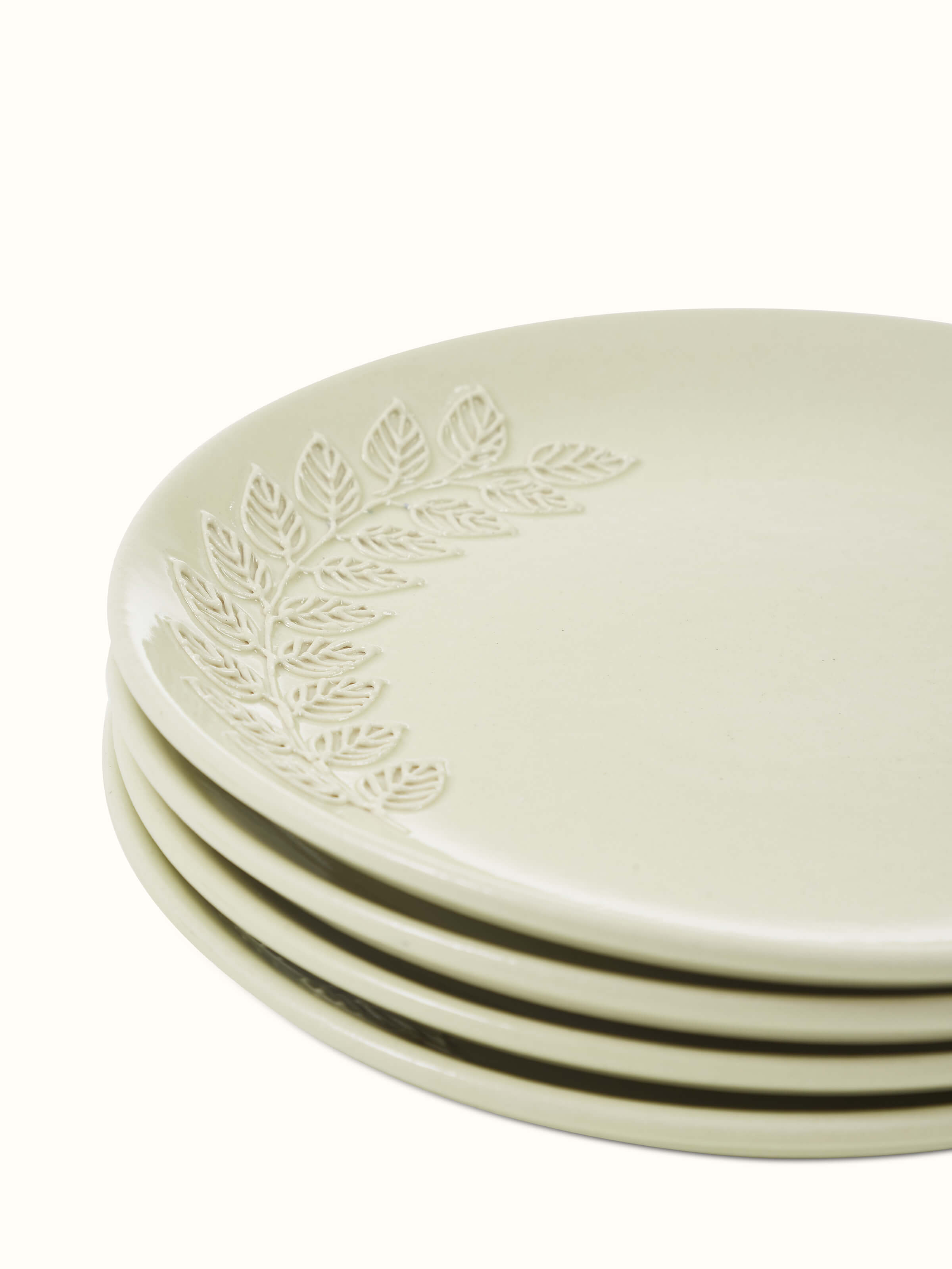 Detailed view of Khurja Pottery Ceramic Salad Plates, highlighting the off-white glaze and subtle design elements.