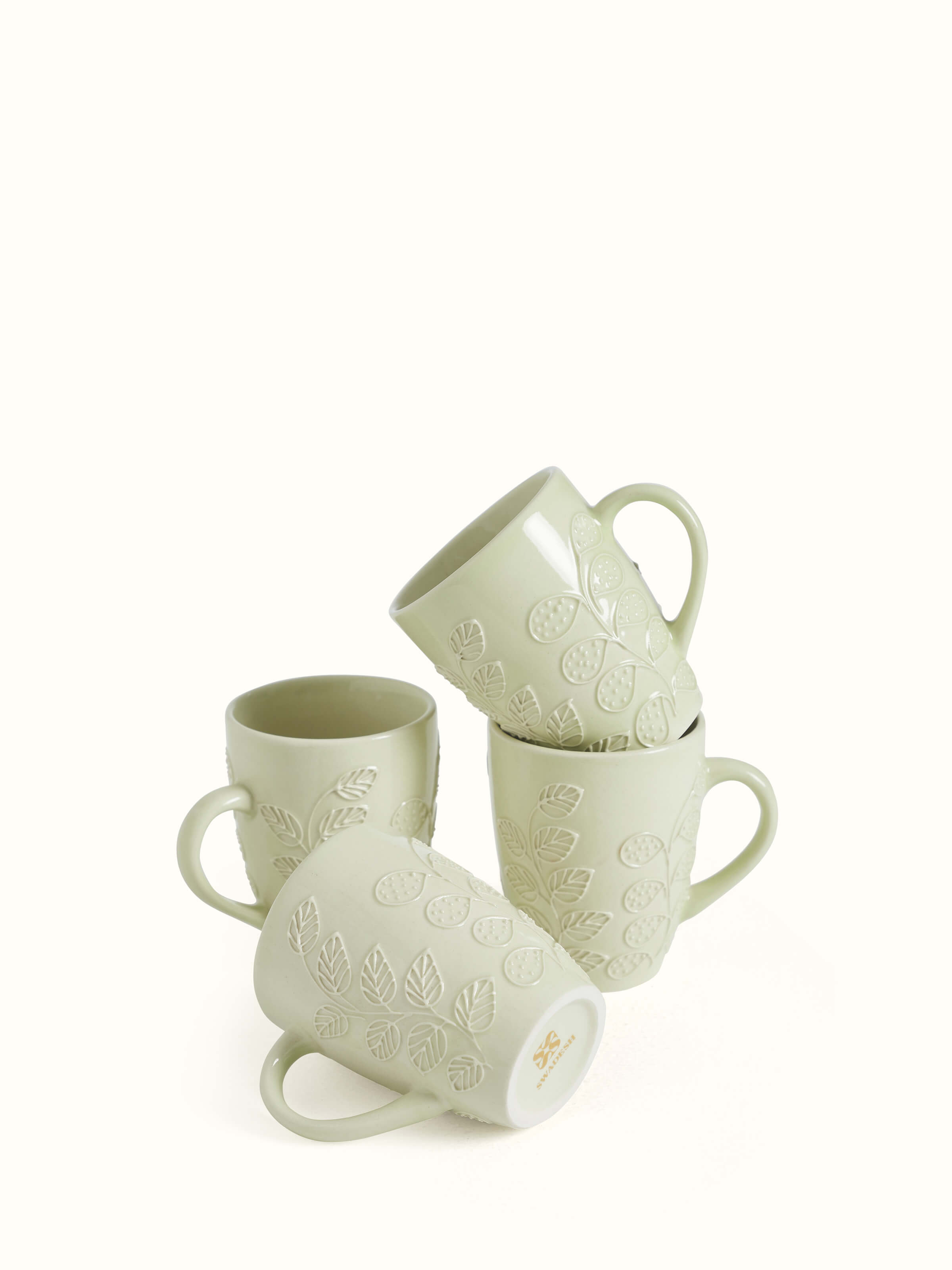 Set view of Khurja pottery ceramic simple coffee mugs in white, featuring clean lines and classic design