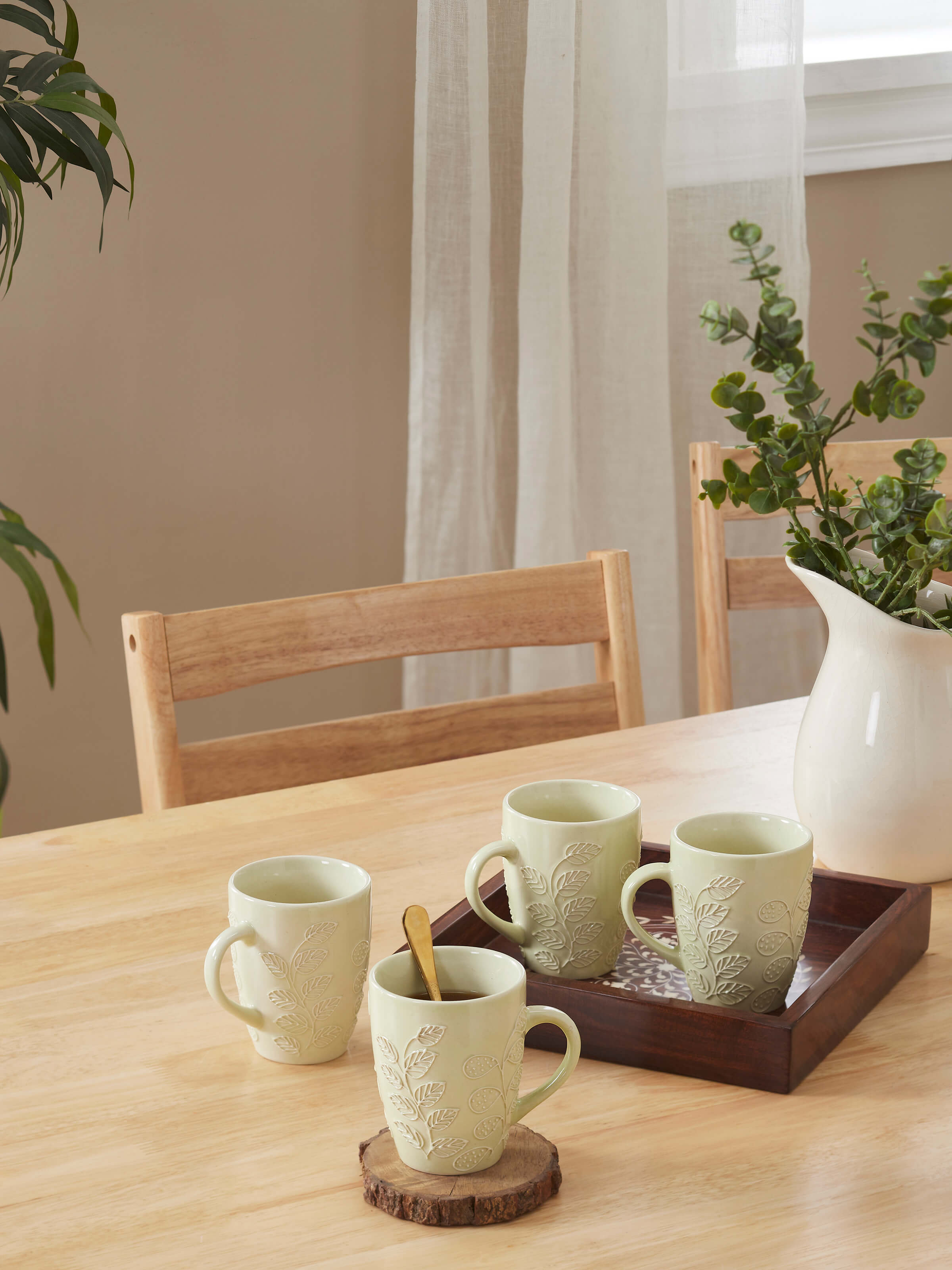 Single mug view of Khurja pottery ceramic simple coffee mugs in white, showcasing its minimalist style