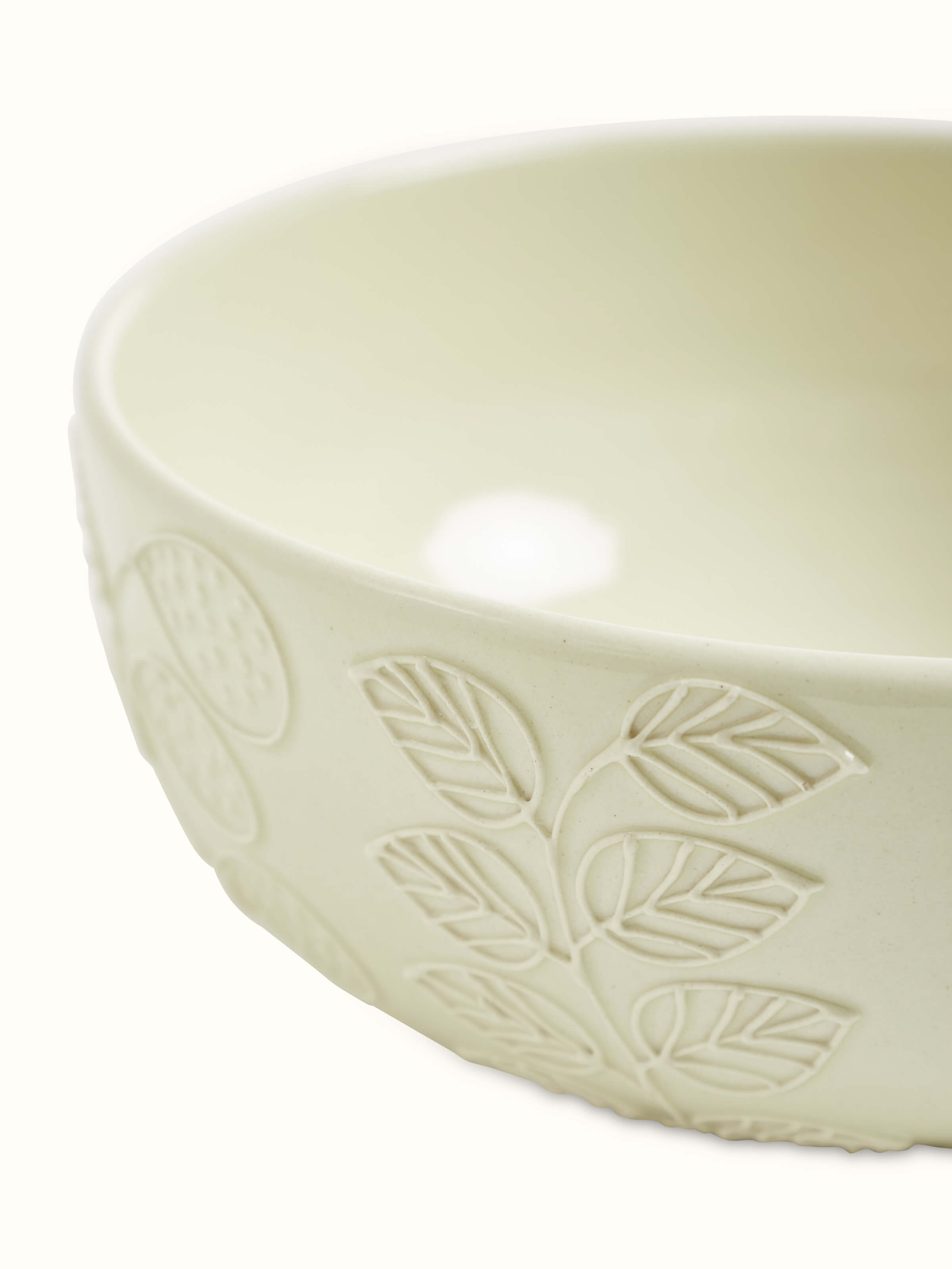 Angle view of Khurja pottery ceramic serving bowl in white, emphasizing its elegant design and functional shape.