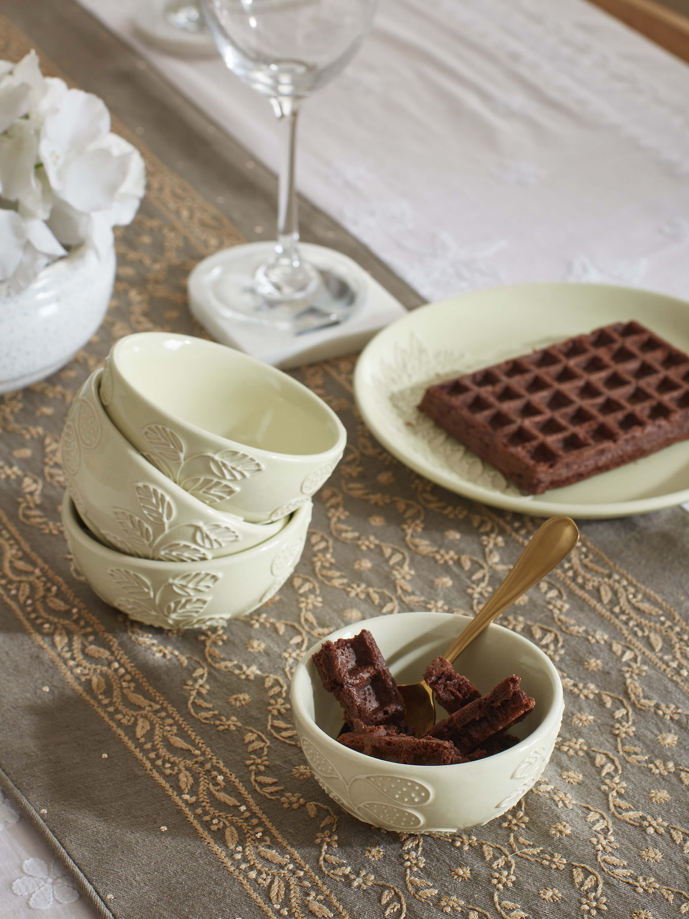 Side view of white Khurja pottery ceramic dinner bowls, emphasizing the smooth texture and finish.