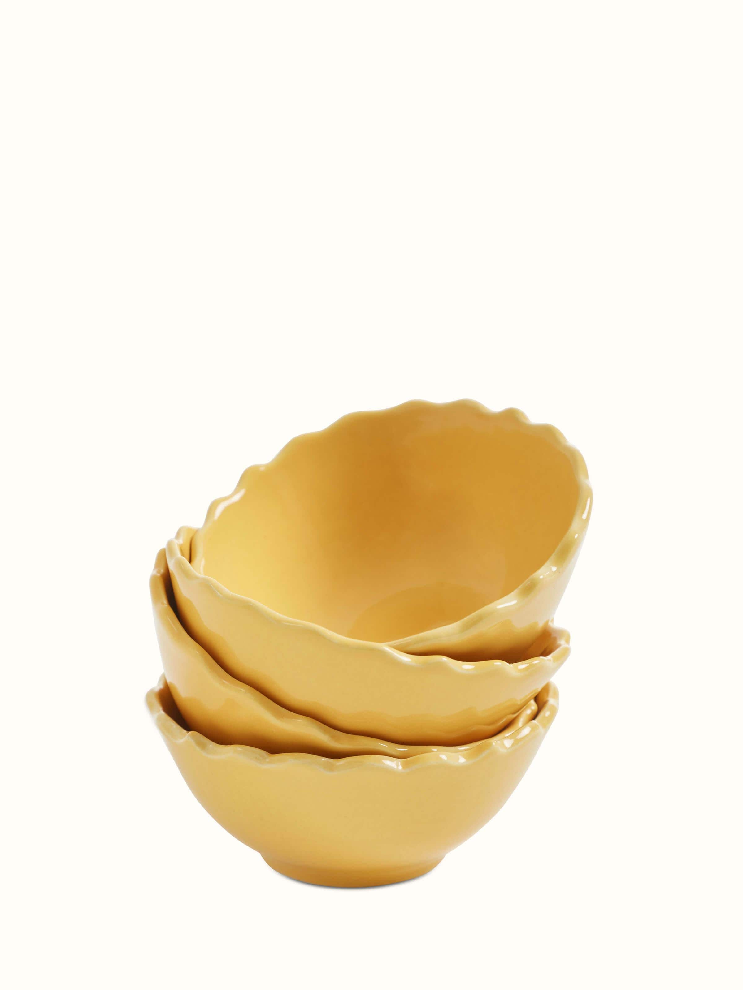 Front view of Khurja pottery ceramic dinner bowls in yellow, set of 4, showcasing the vibrant color and traditional design.