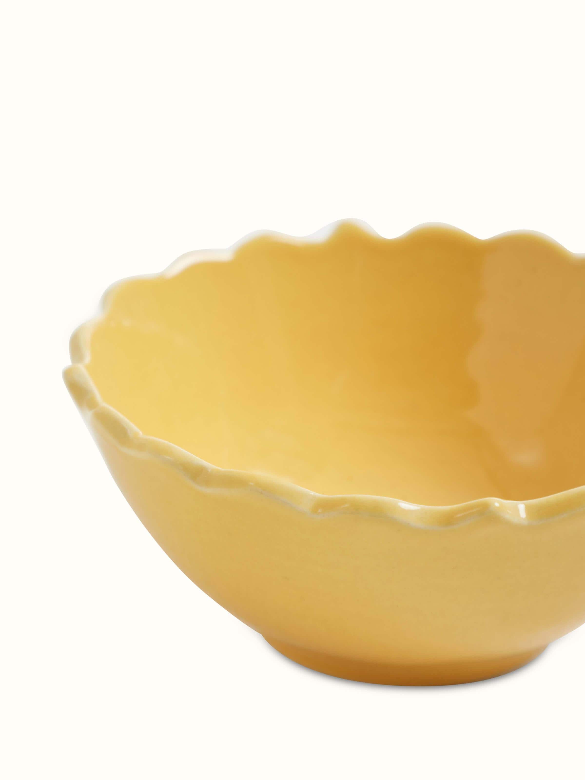 Detailed view of Khurja pottery ceramic dinner bowls in yellow, set of 4, showcasing the fine craftsmanship and color.