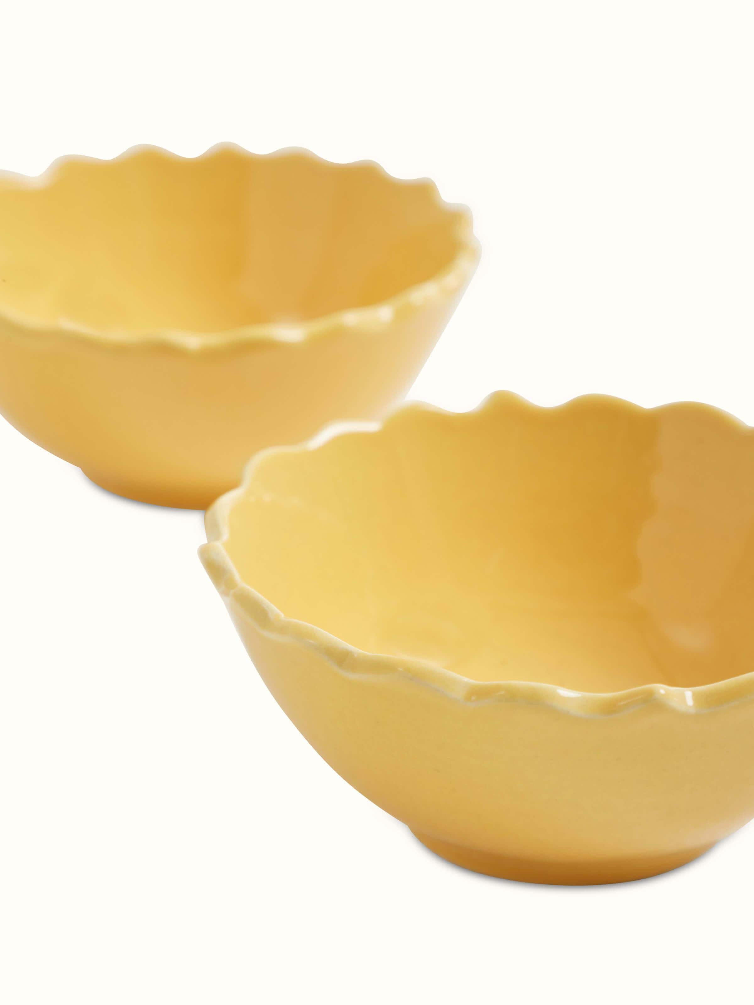 Top view of Khurja pottery ceramic dinner bowls in yellow, set of 4, highlighting the bright color and bowl shape.