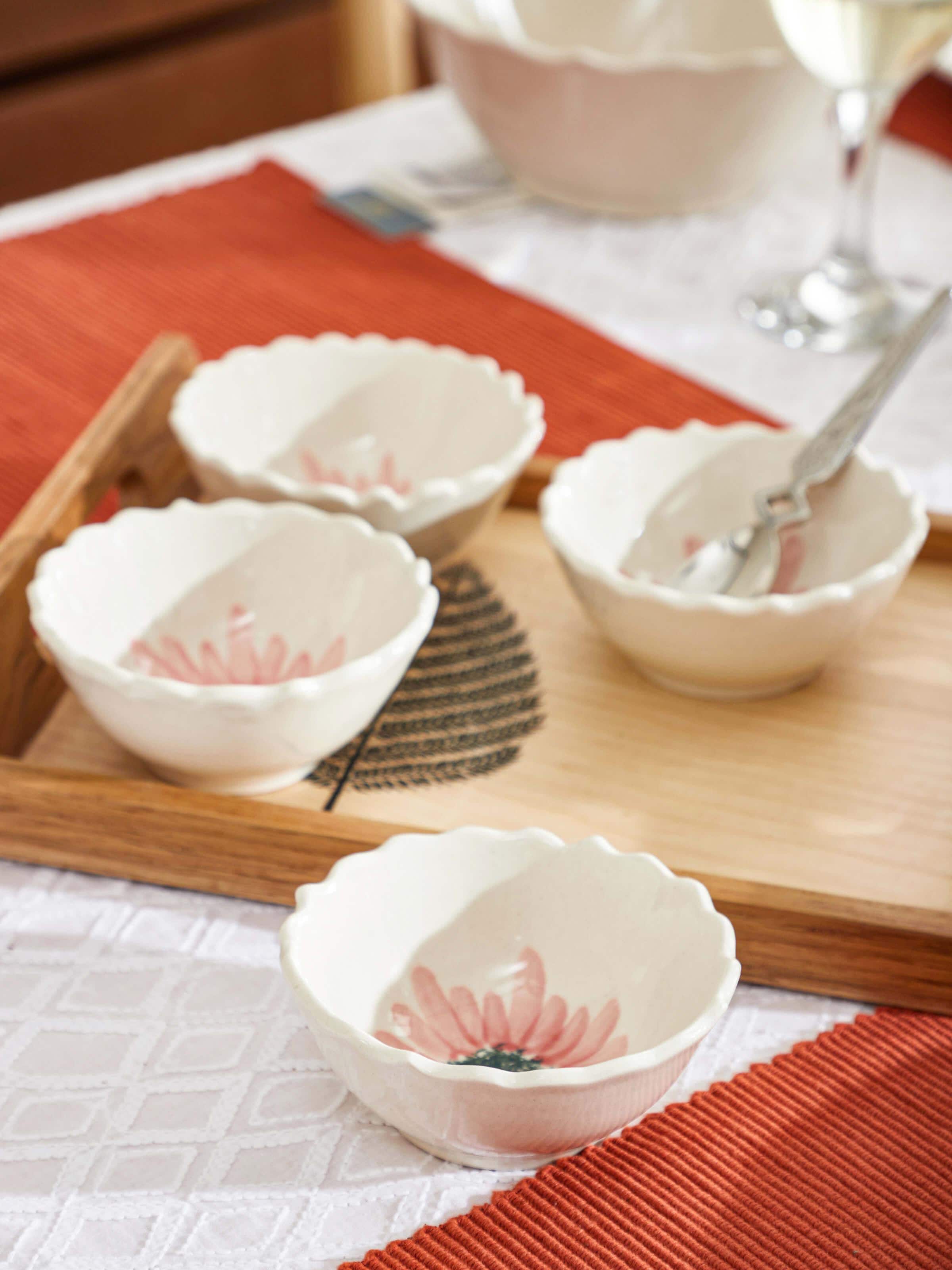 Angled view of Khurja pottery ceramic simple dinner bowls in white, showcasing simplicity.