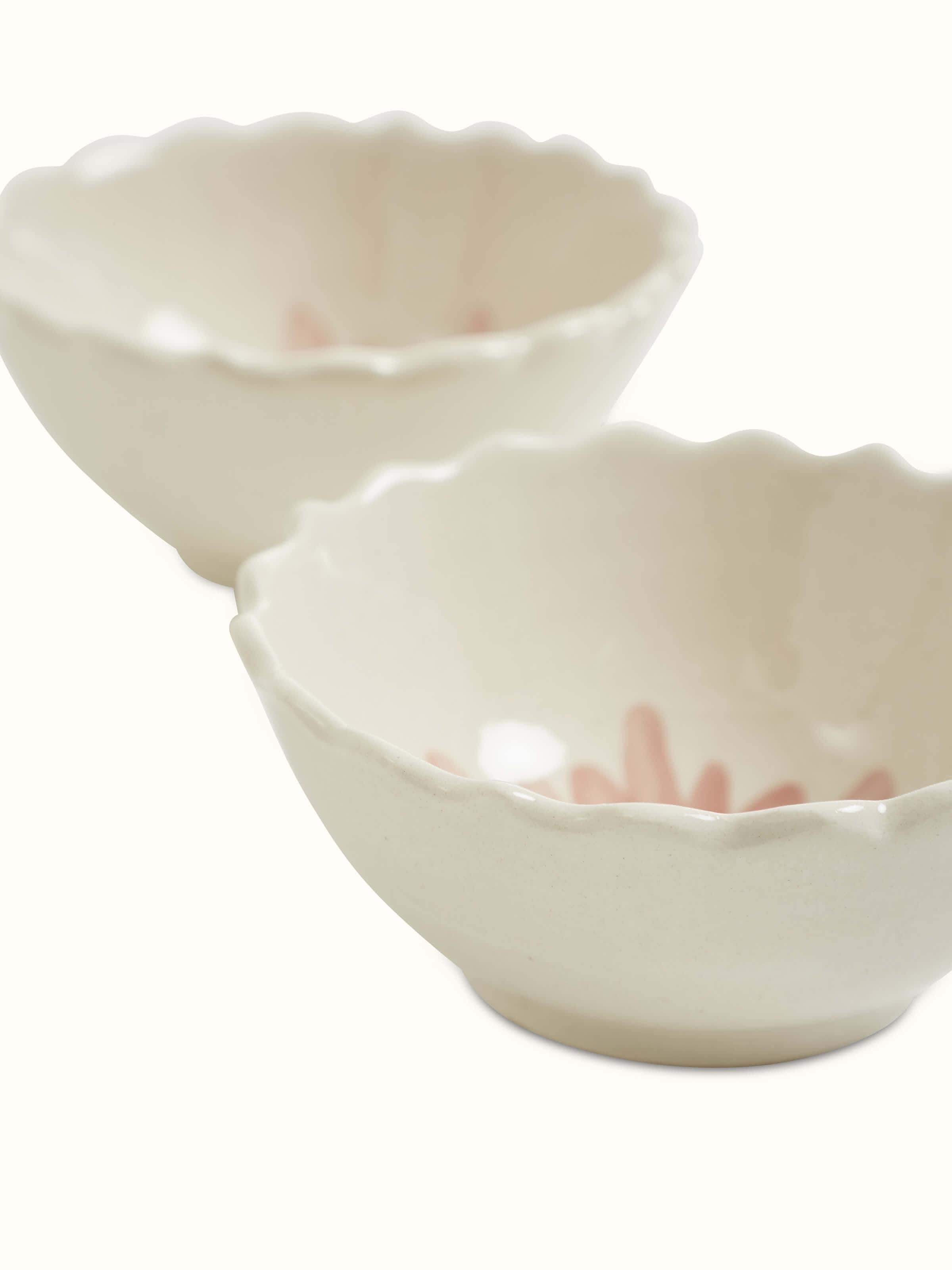 Close-up view of Khurja pottery ceramic simple dinner bowls in white, focusing on texture.