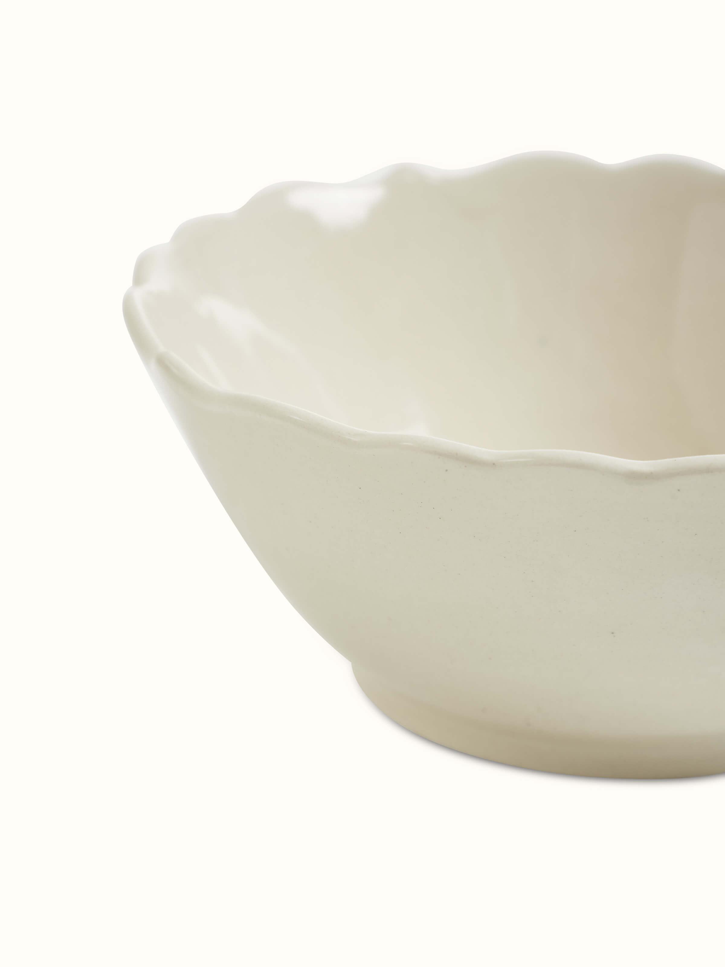 Angle view of Khurja pottery ceramic serving bowl in plain white.