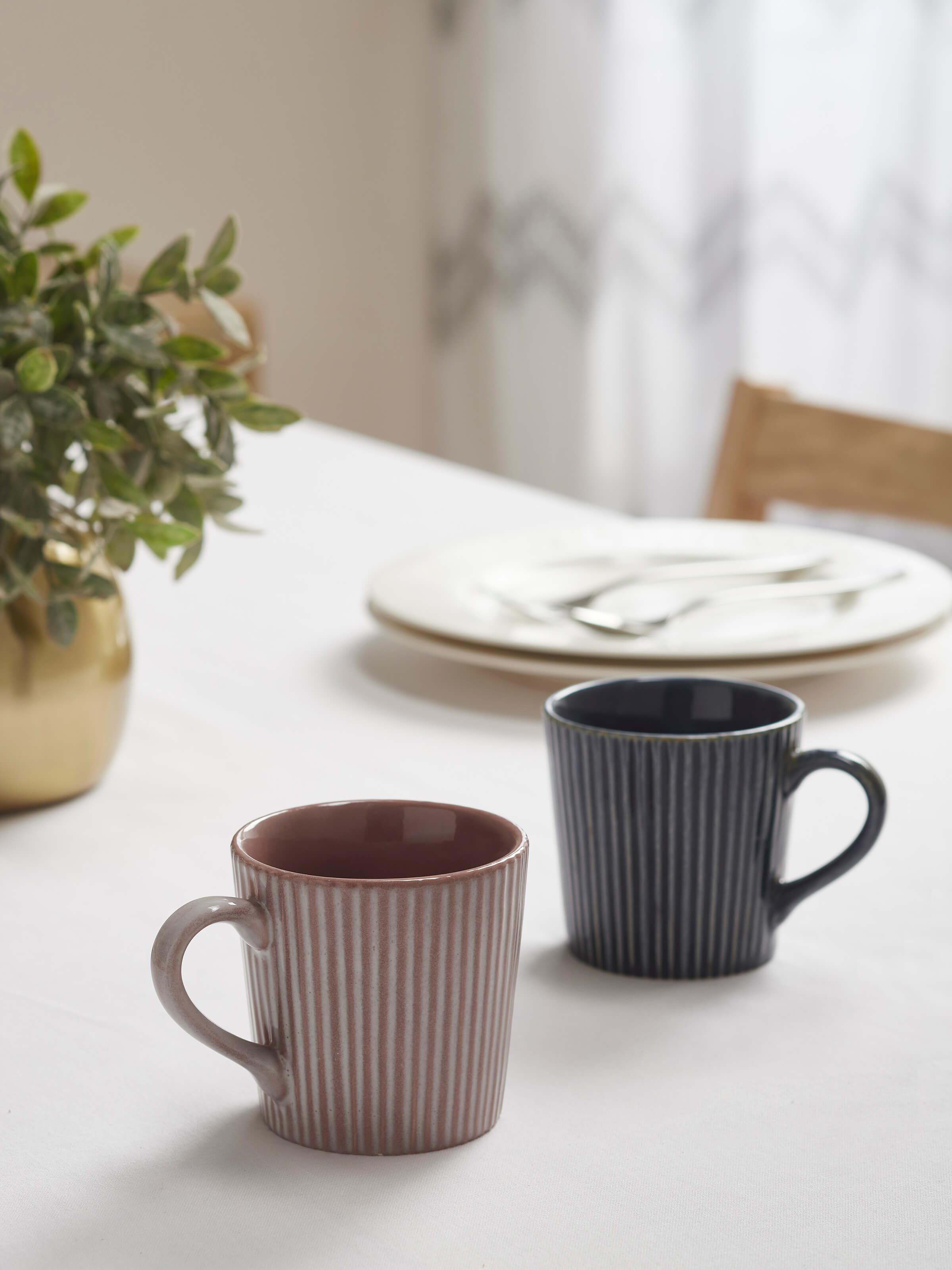 Side view of blue and white Khurja pottery ceramic coffee mugs (2 pcs) highlighting the intricate detailing and craftsmanship.
